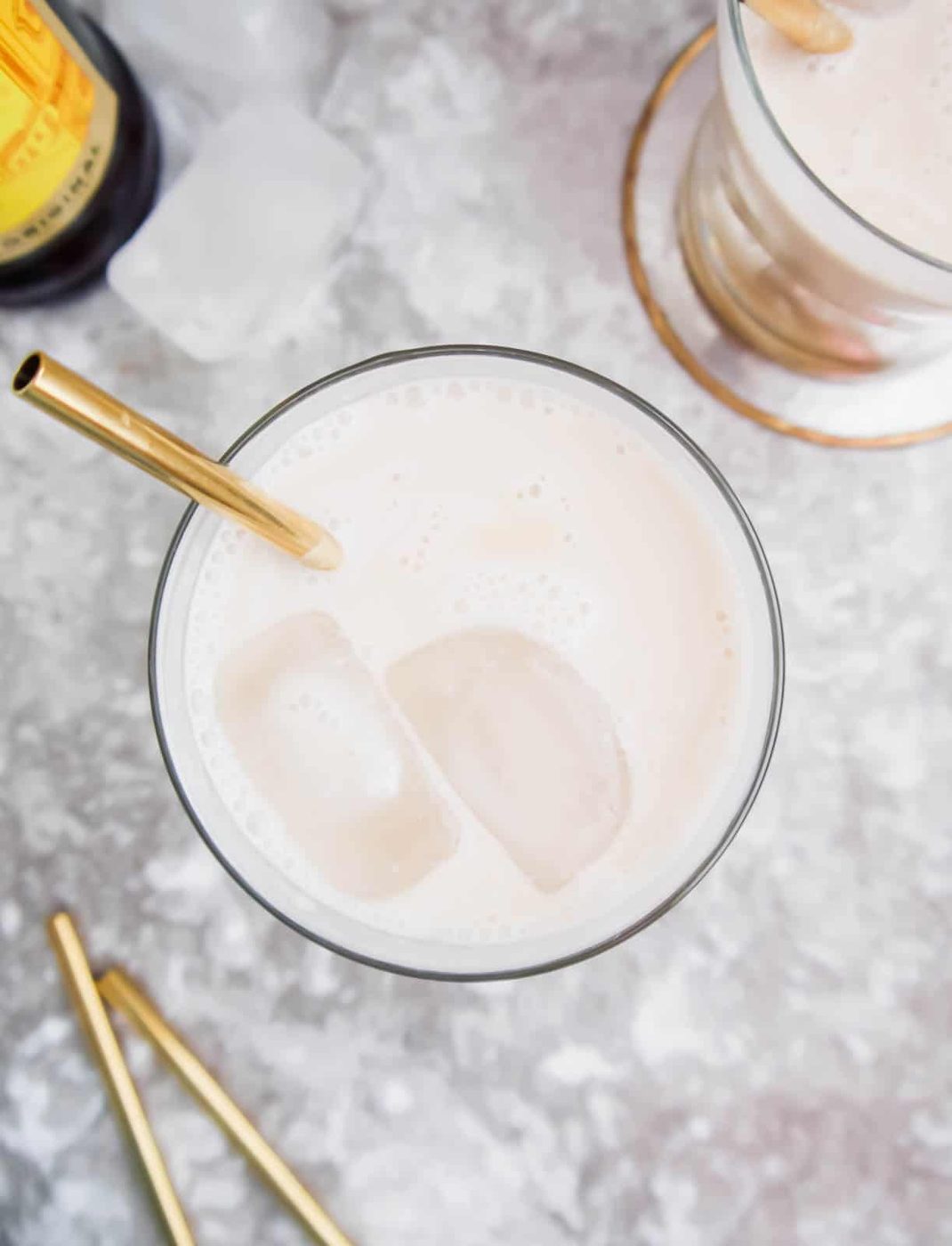 Aerial view of white Russian, can see ice cubes in it.
