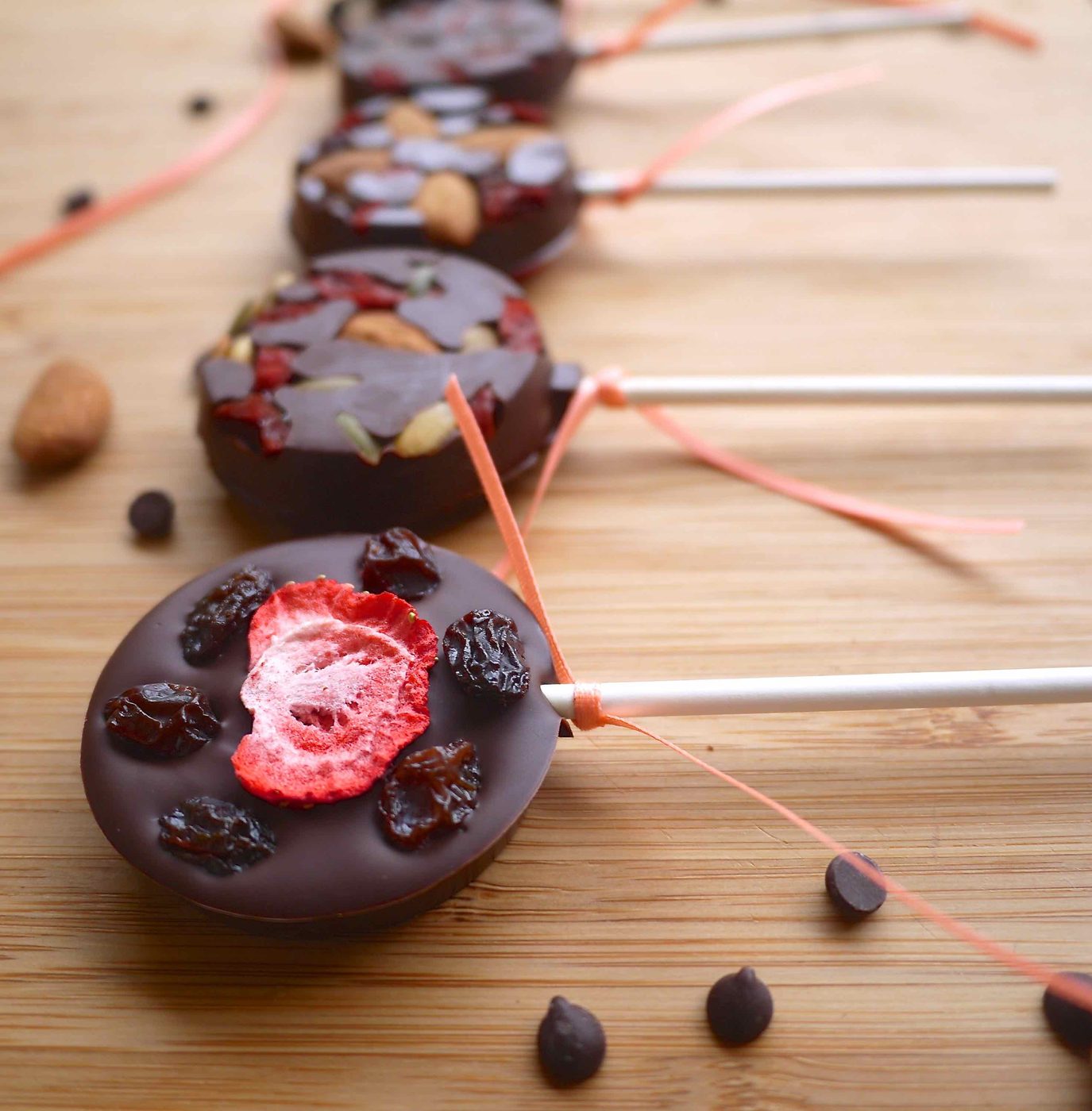 Chocolate lollipops with dried fruits.