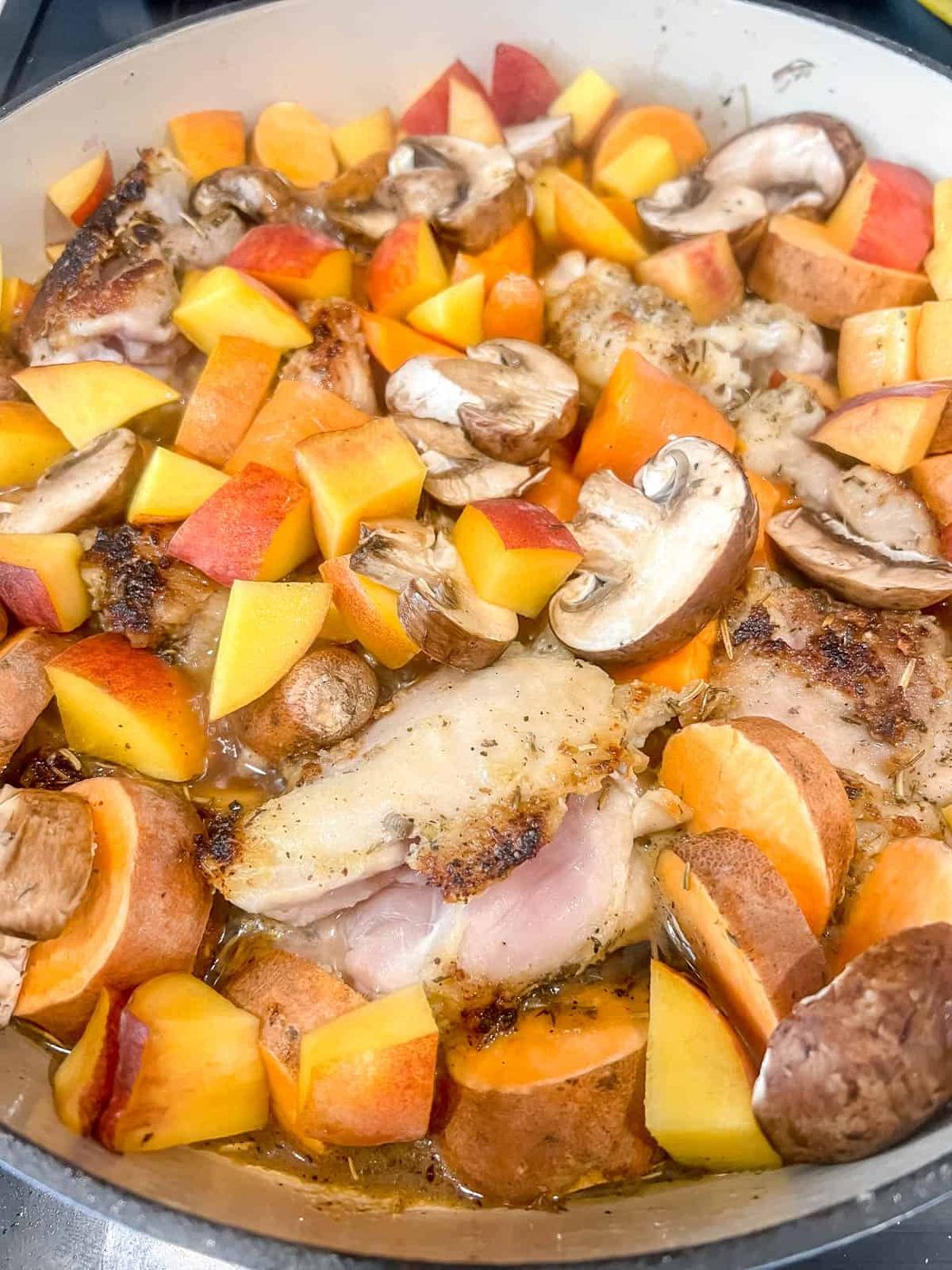 Boiling the dutch oven chicken thighs for a few minutes.