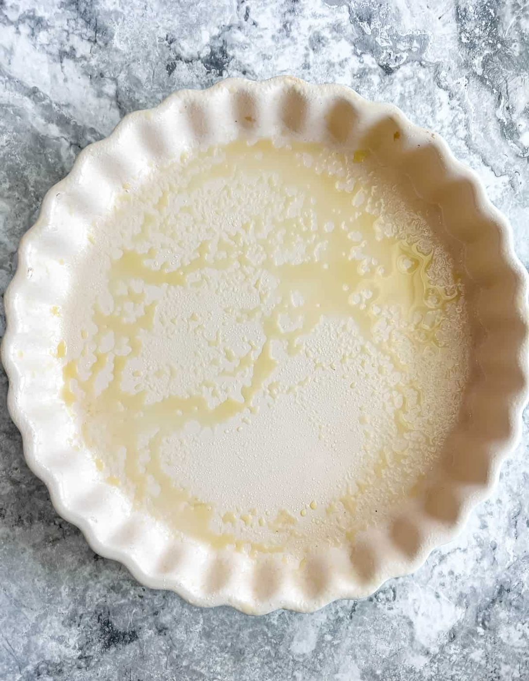 A greased tart pan.