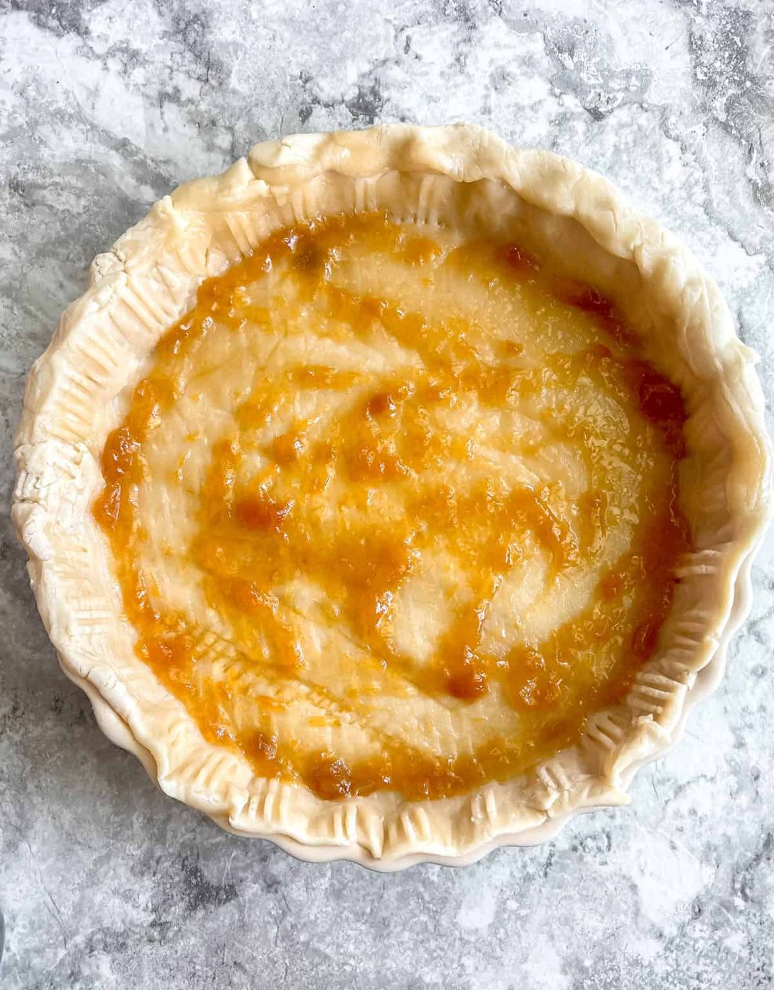 A layer of jam added to the tart.