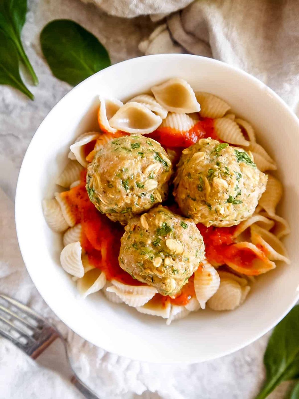 Turkey spinach meatballs with pasta and tomato sauce.
