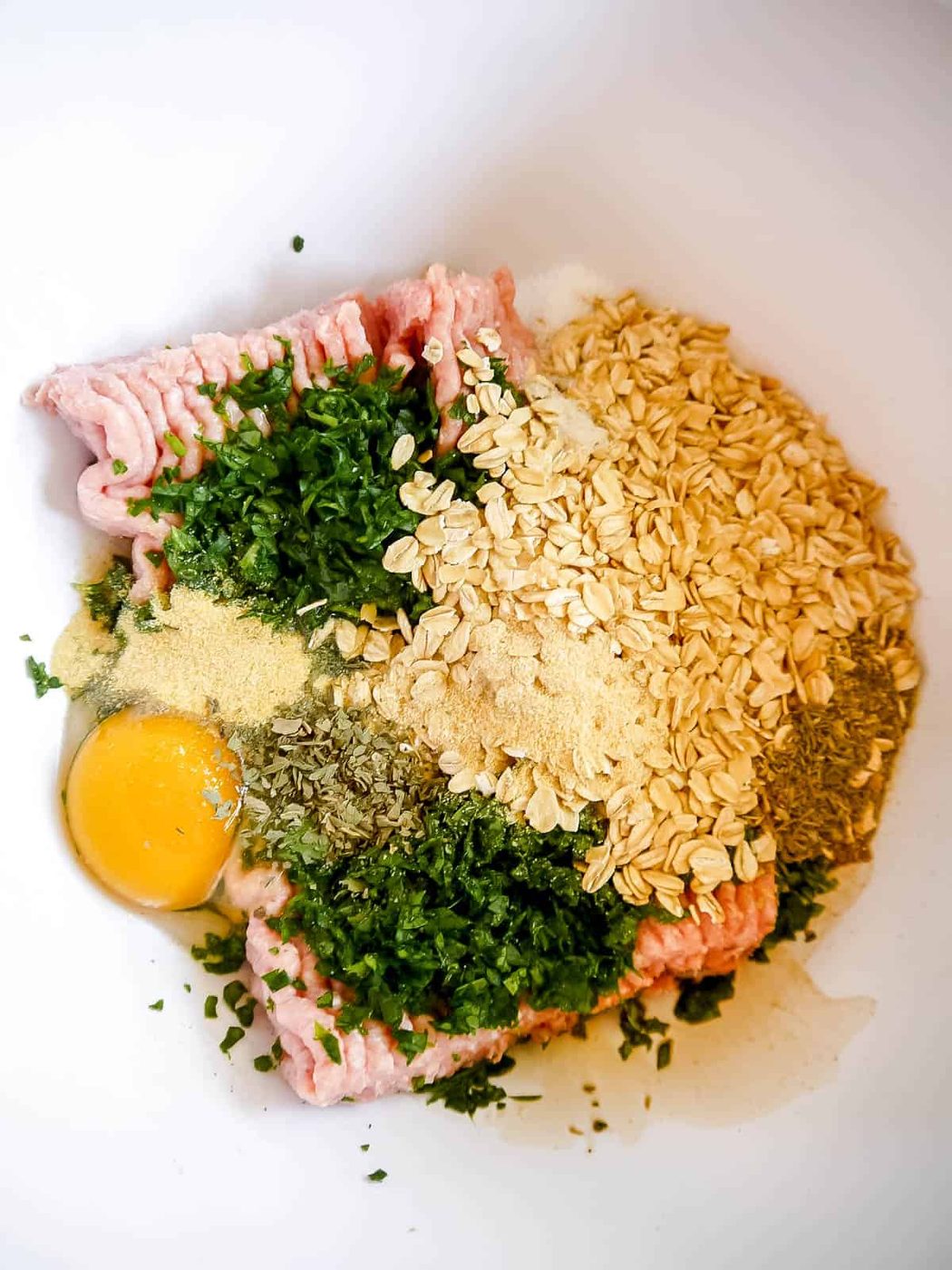All turkey spinach meatballs ingredients in bowl