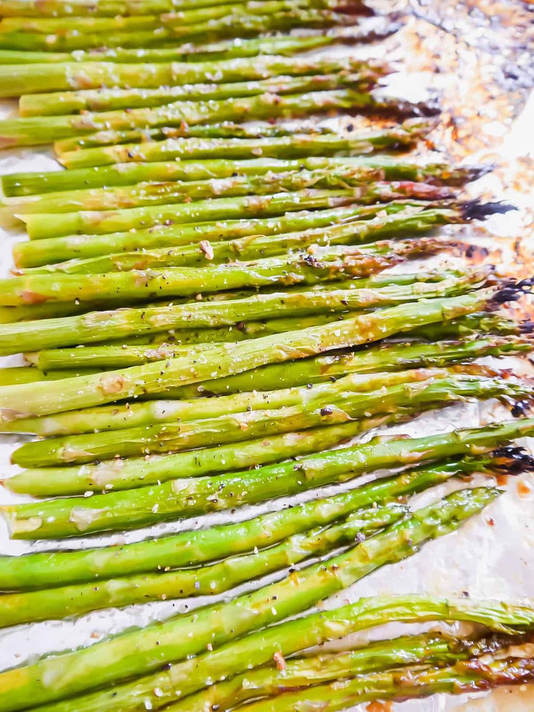 Lemon asparagus broiled on a pan.