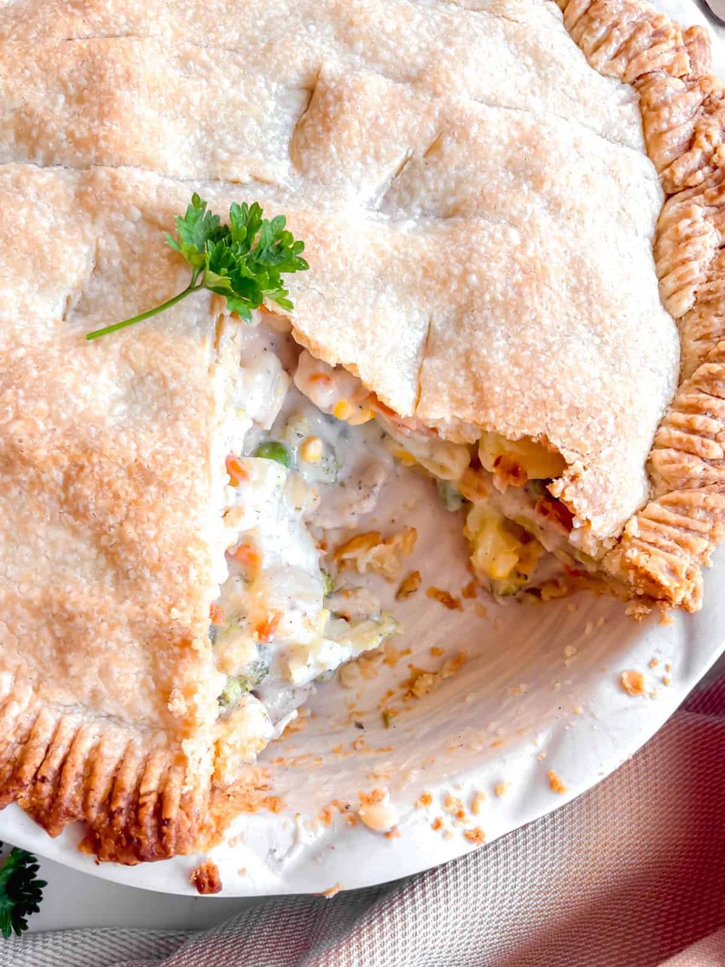 A slice cut out of a chicken pot pie.