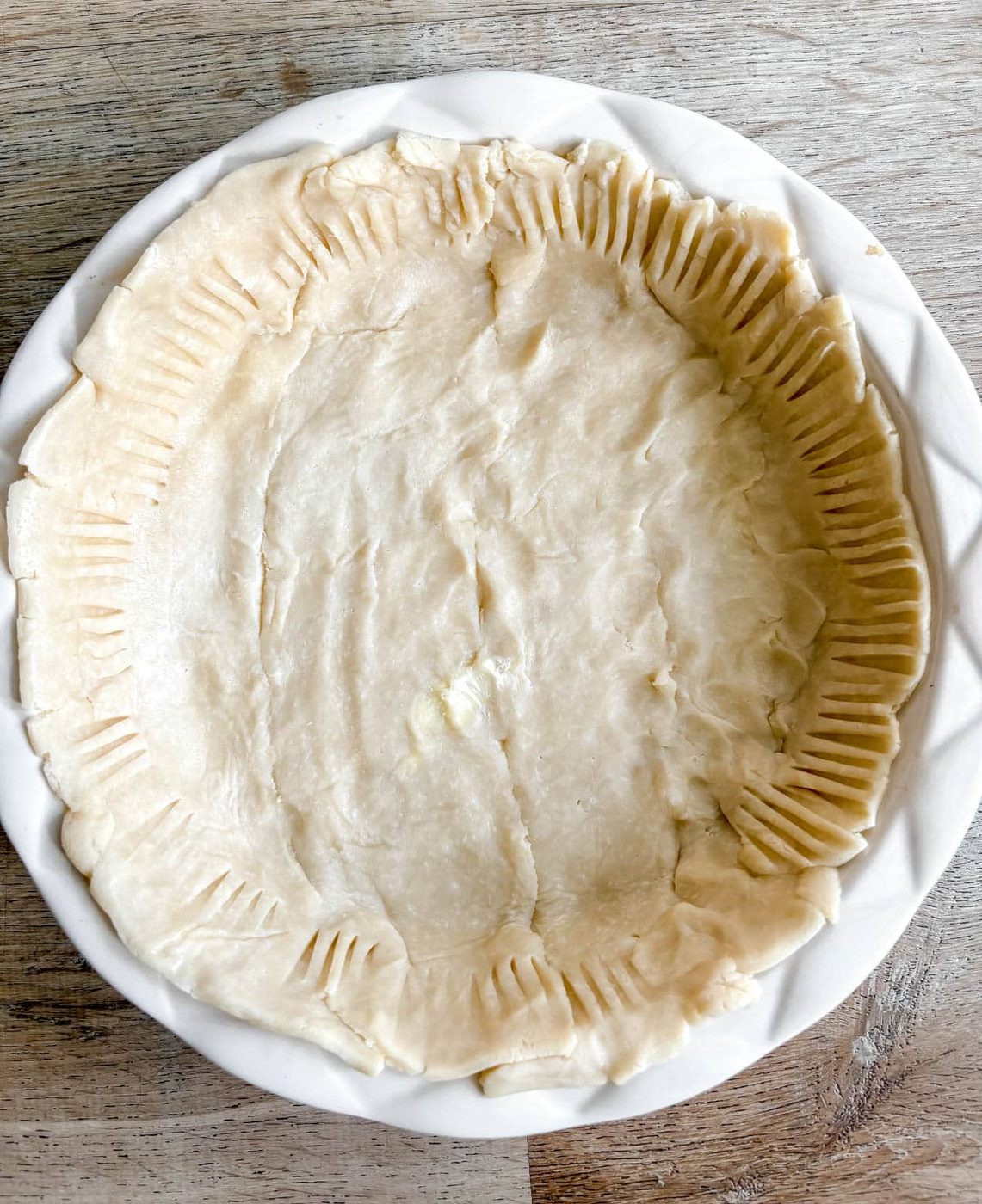 One store-bought pie crust added to a deep dish pie pan.