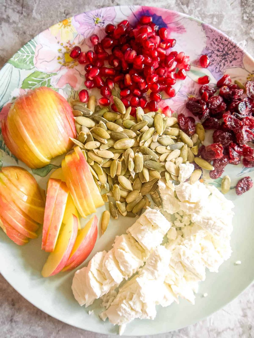 Salad ingredients prepped on a palte.