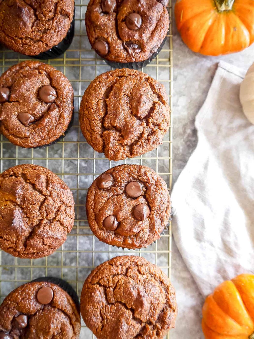 Gluten-free dairy-free pumpkin muffins on a drying rack.