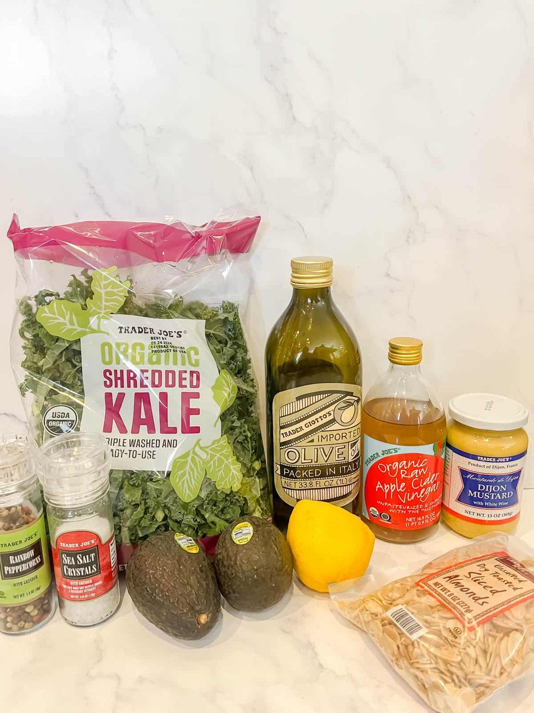Ingredients needed to make salad with kale and avocado.