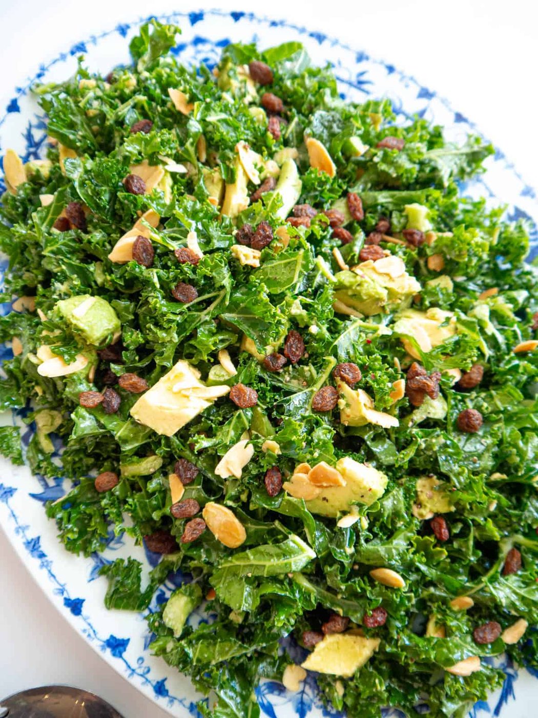 Chopped Kale and Avocado Salad with Lemon Dressing in a serving bowl.