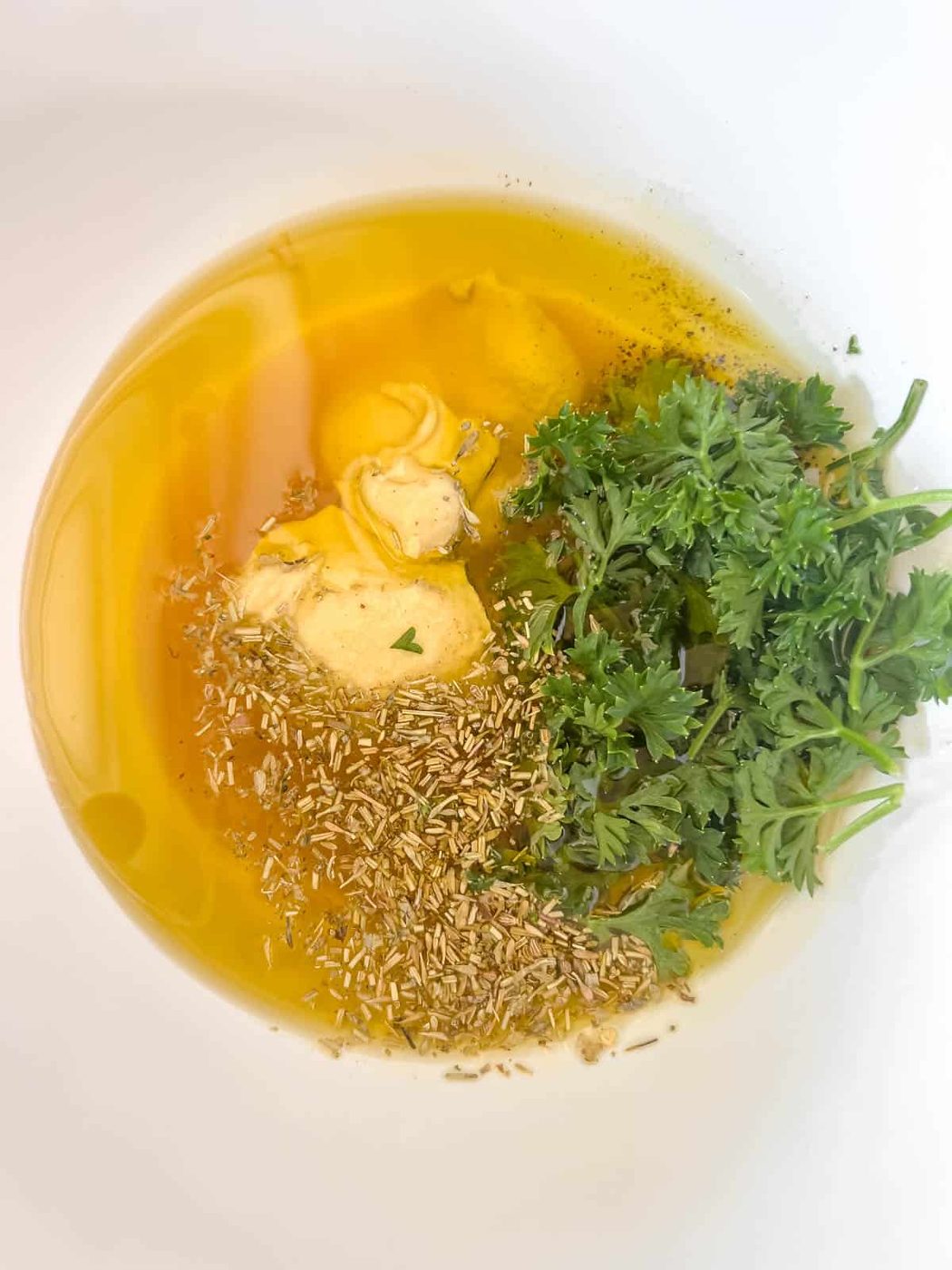Dressing ingredients in a bowl.