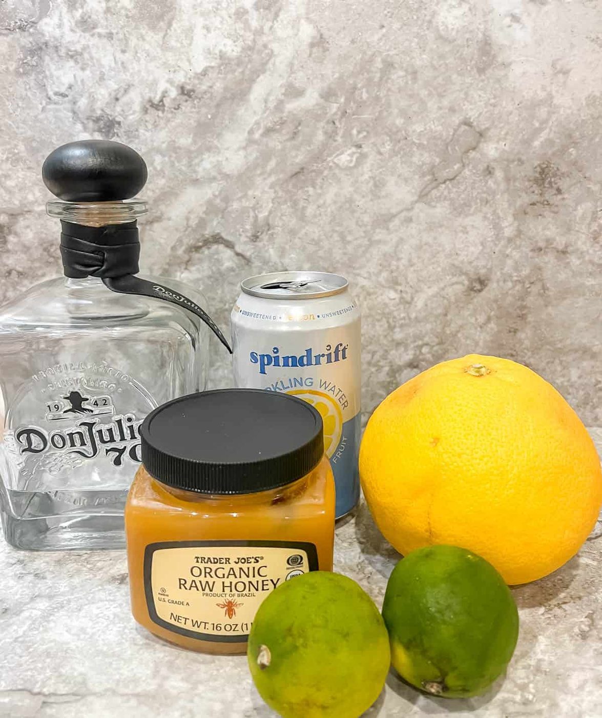 Ingredients needed to make a from-scratch paloma cocktail.