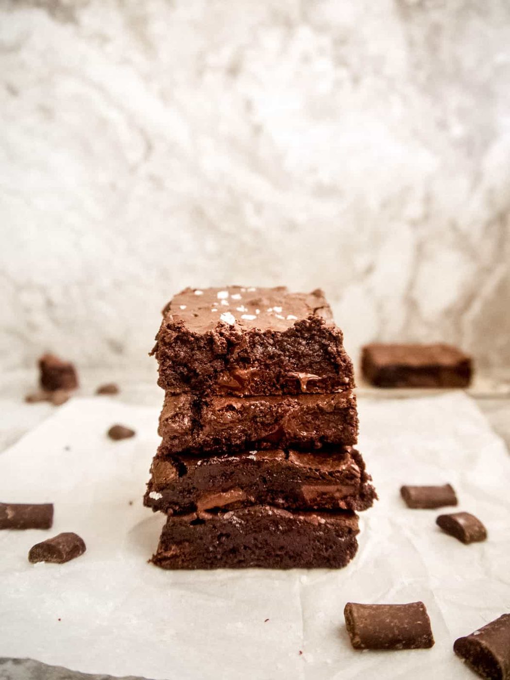 Gluten-free brownies with almond flour stacked on top of each other.