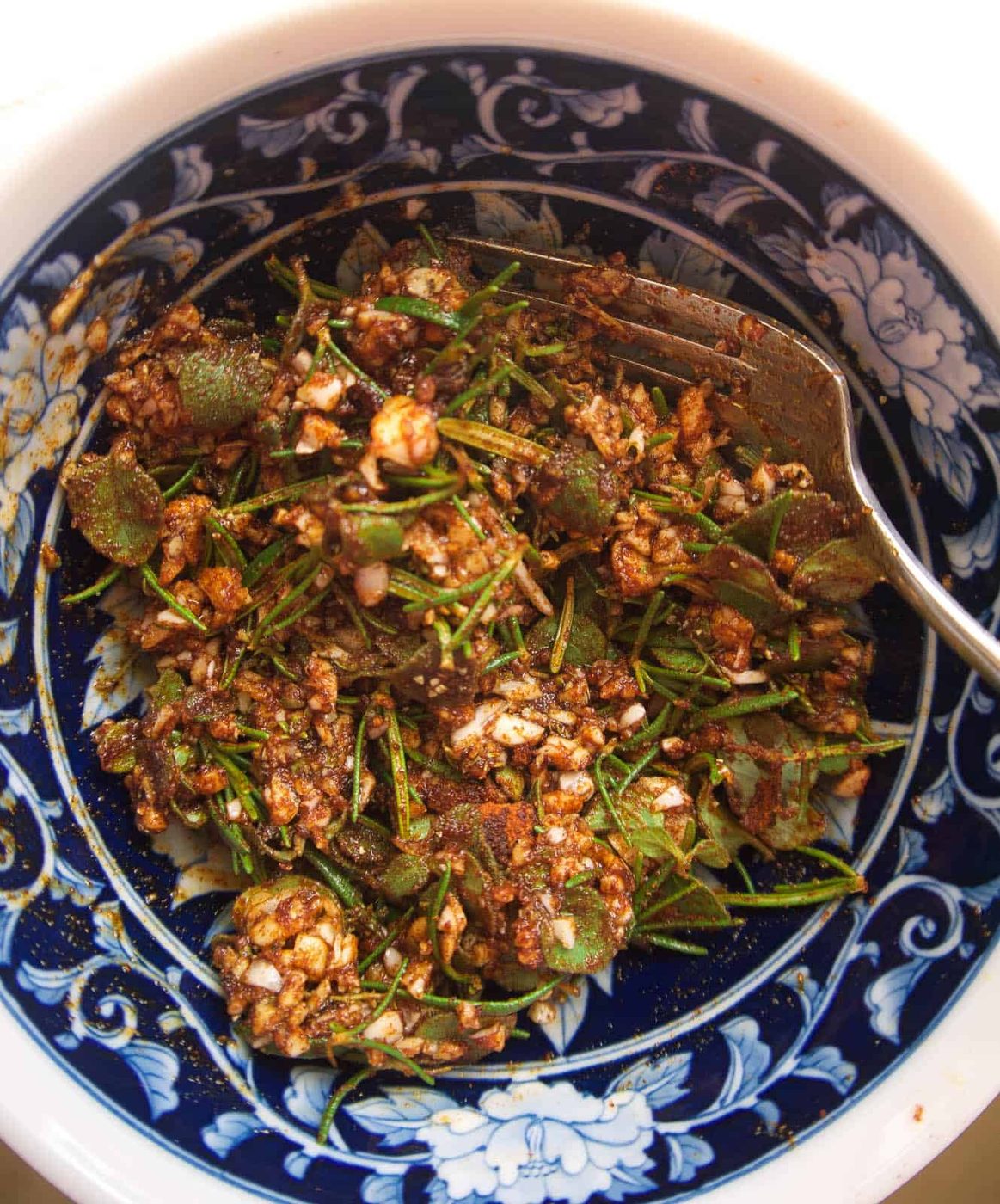 Garlic and herb paste in a bowl.