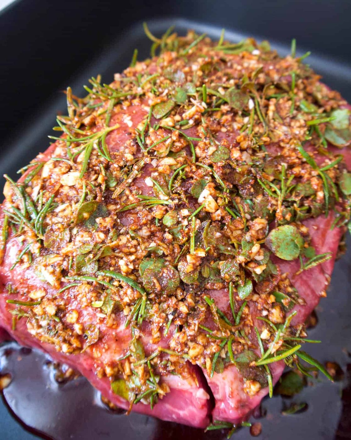 Raw heart of clod covered in garlic and herb paste.
