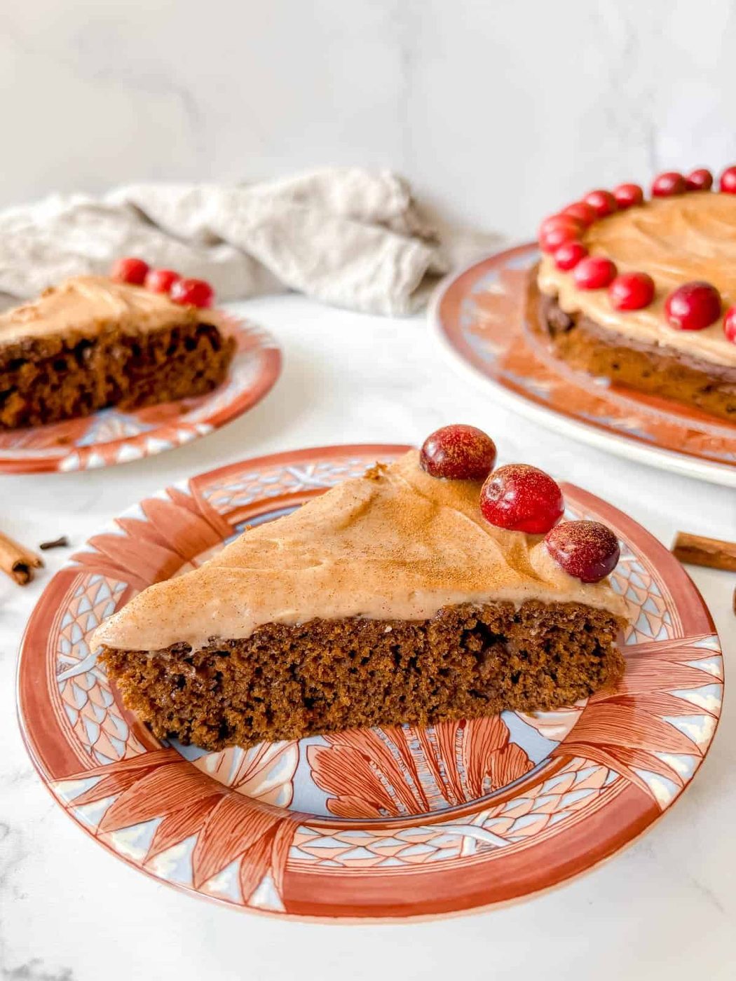 A slice of gingerbread snacking cake on a plate.