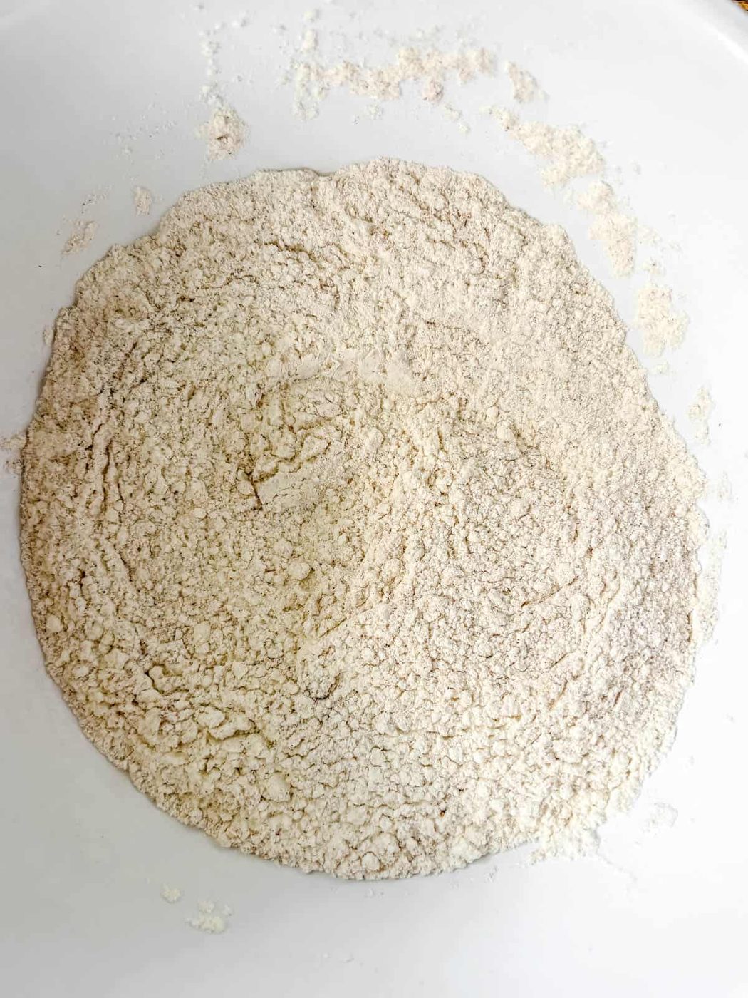 Dry ingredients in a bowl for Gingerbread Cake with Cinnamon Cream Cheese Frosting.