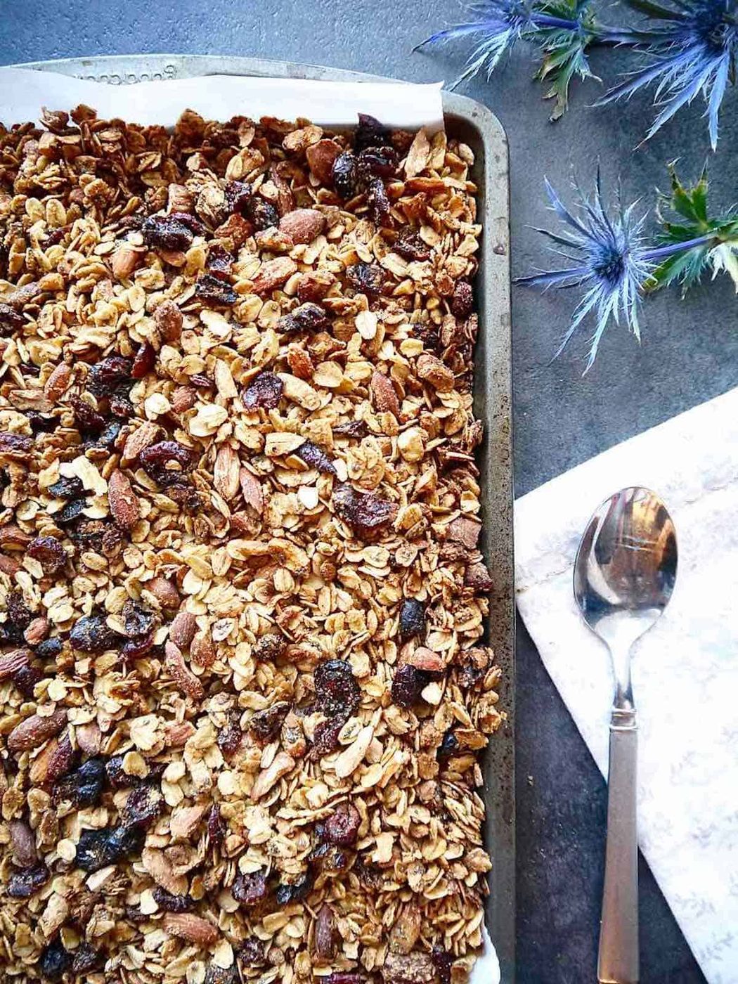 Almond granola with olive oil in a pan.