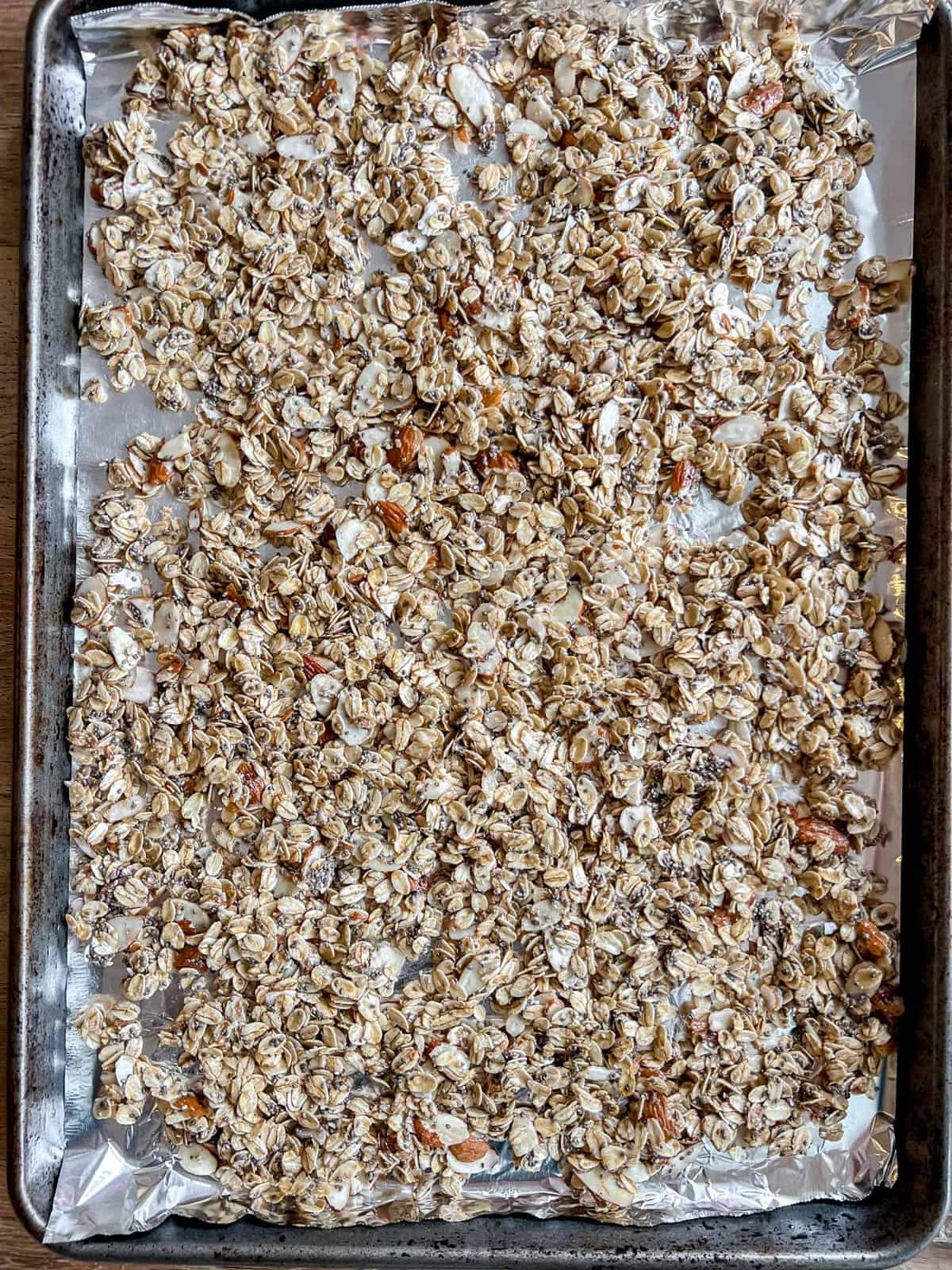 Granola with almonds and chia seeds before baking.