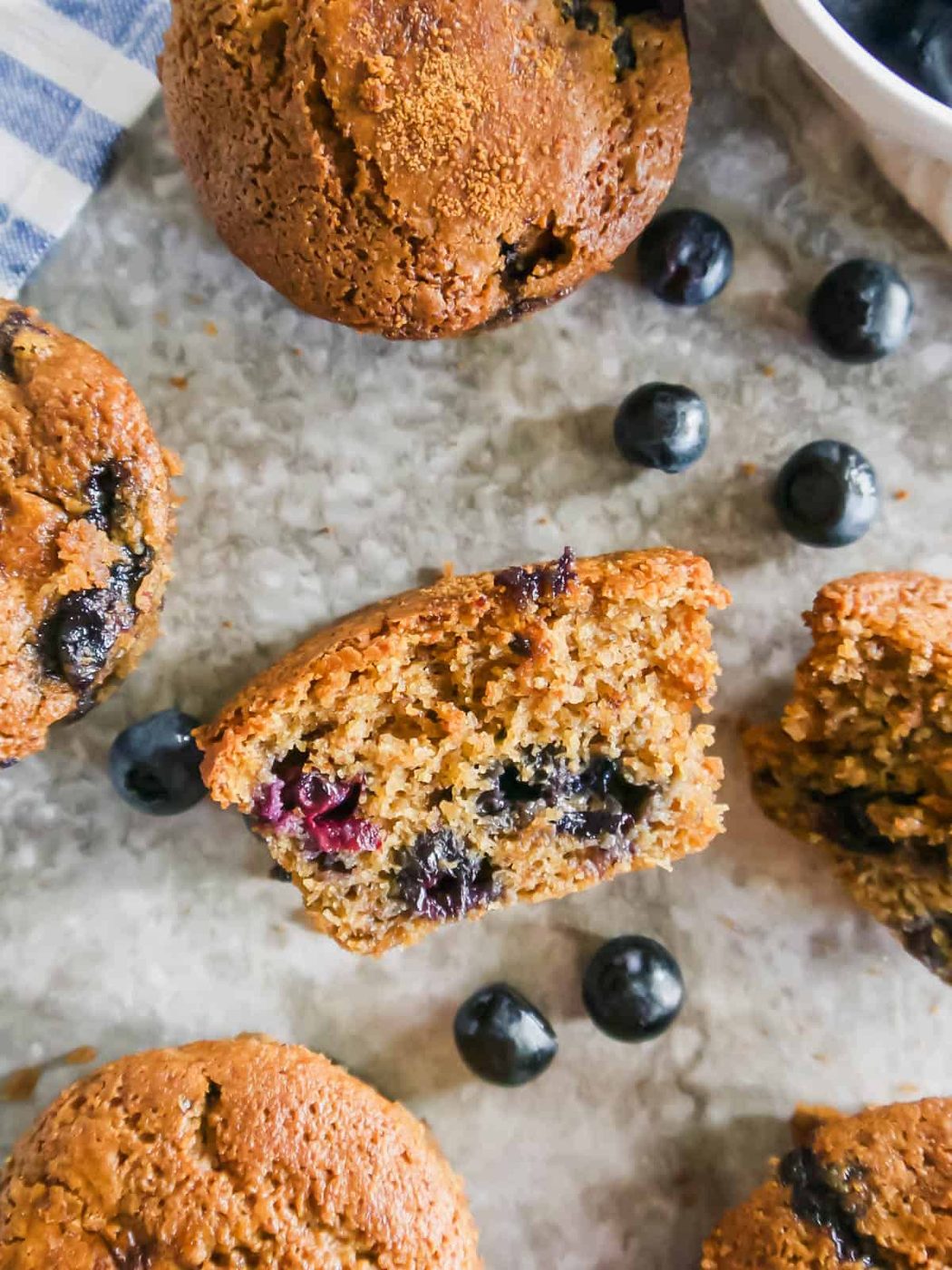 A gluten free dairy free blueberry muffin cut in half.