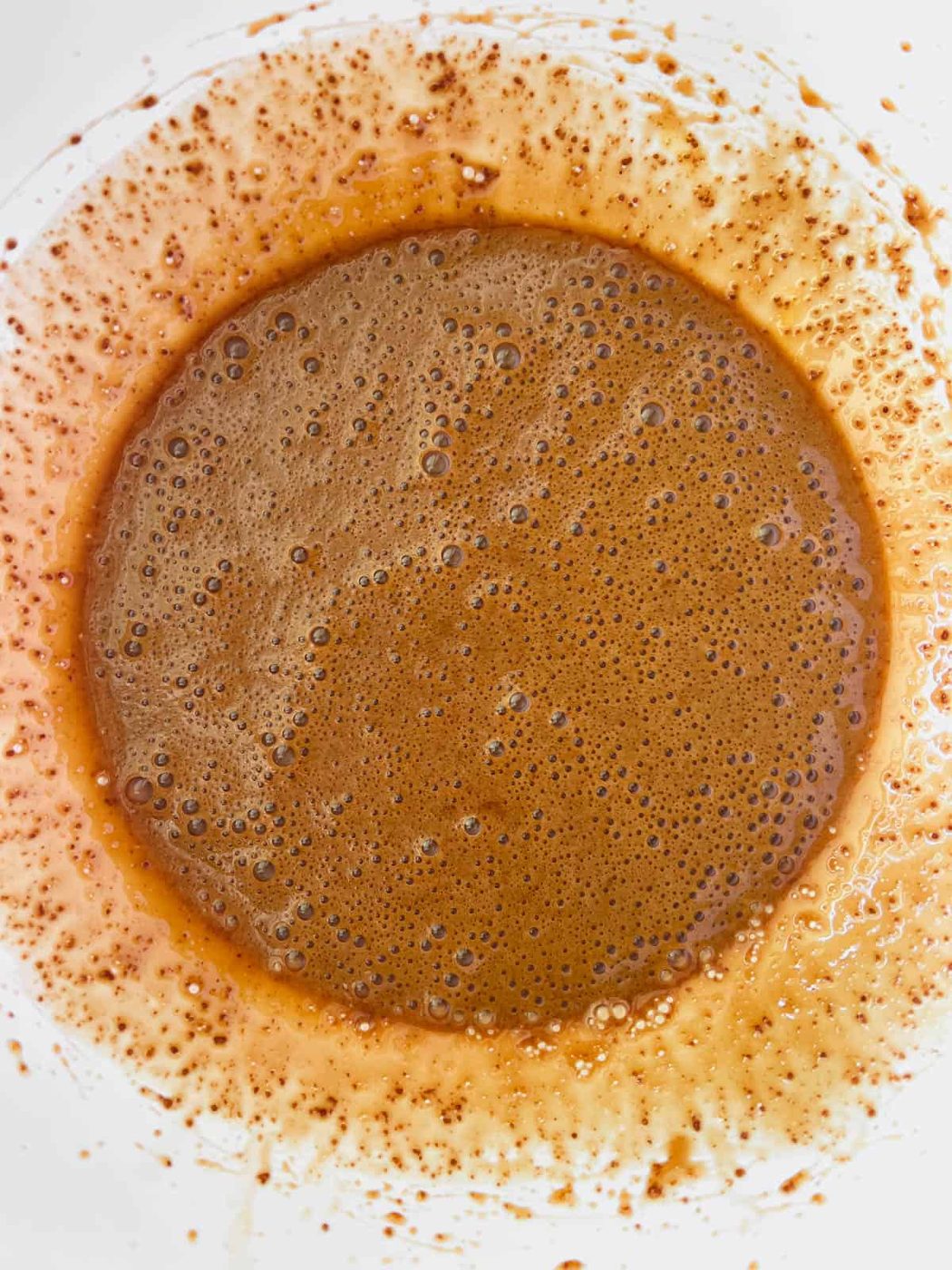Some of the wet ingredients mixed in a bowl.
