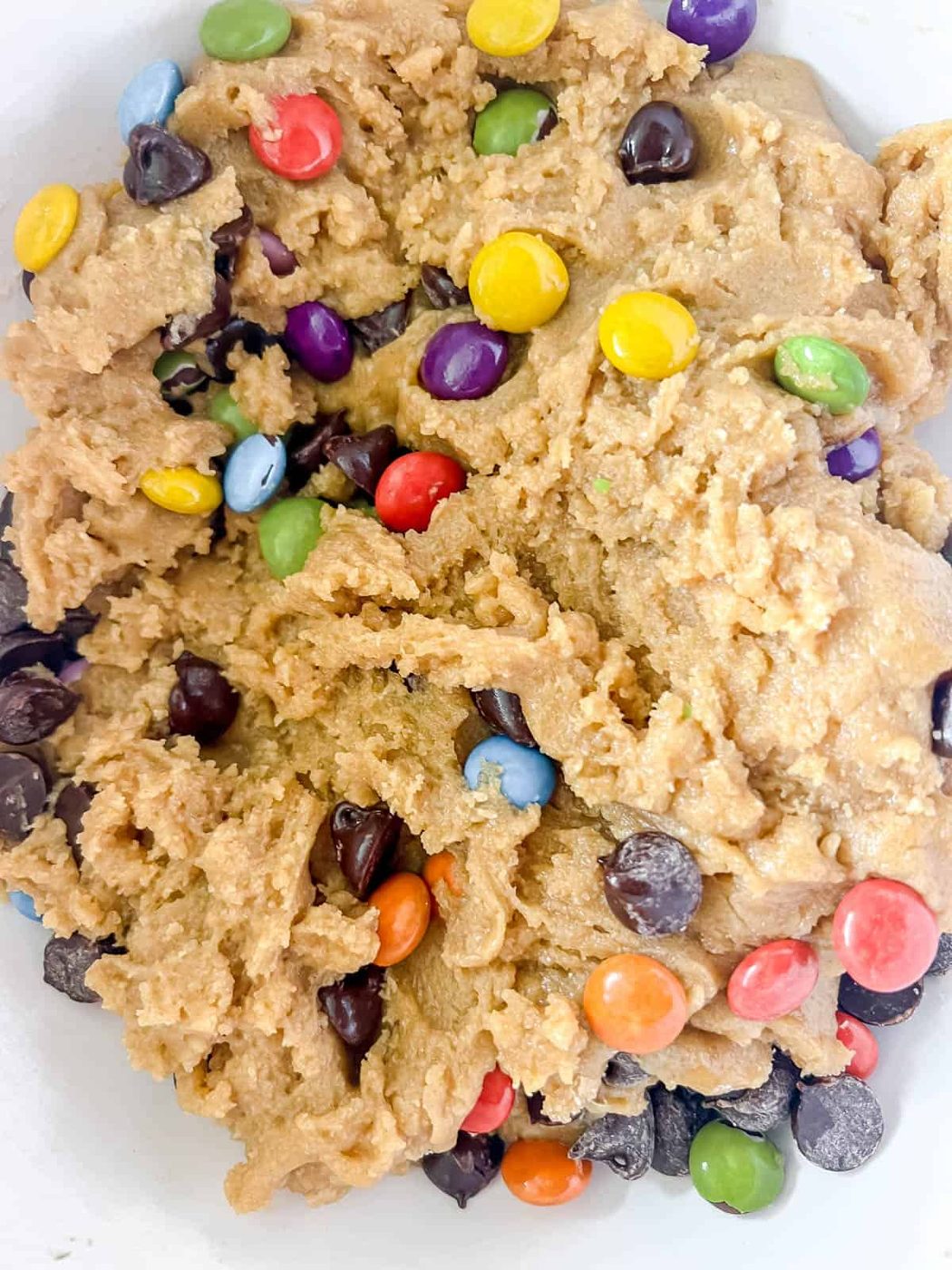 Raw cookie bar dough with chocolate chips inside.