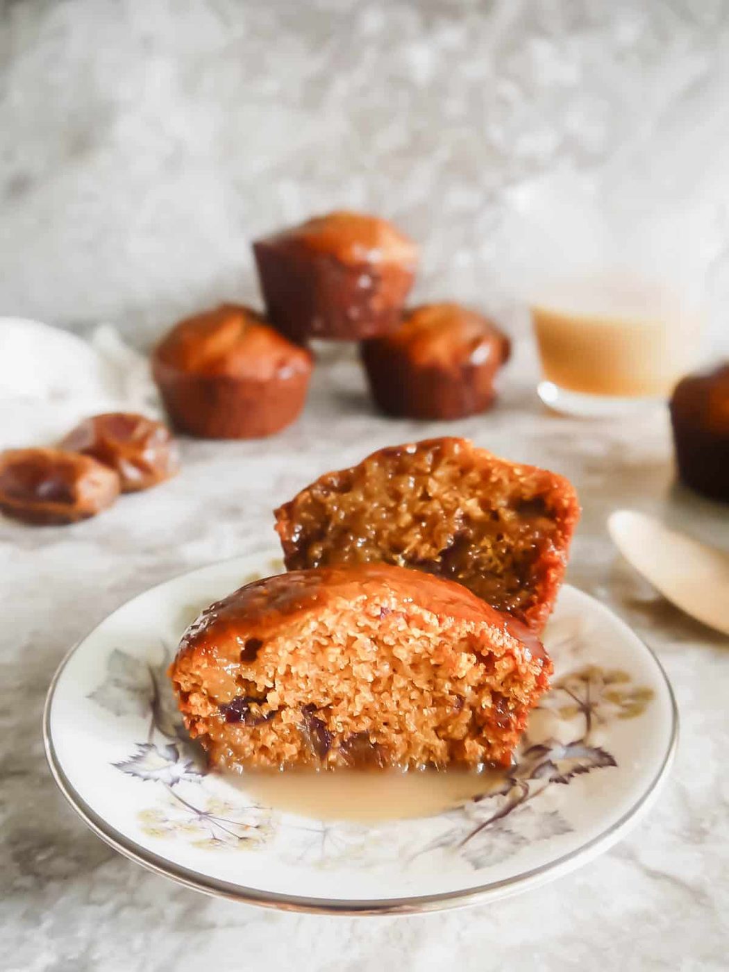 A dairy free sticky toffee pudding muffin cut in half.
