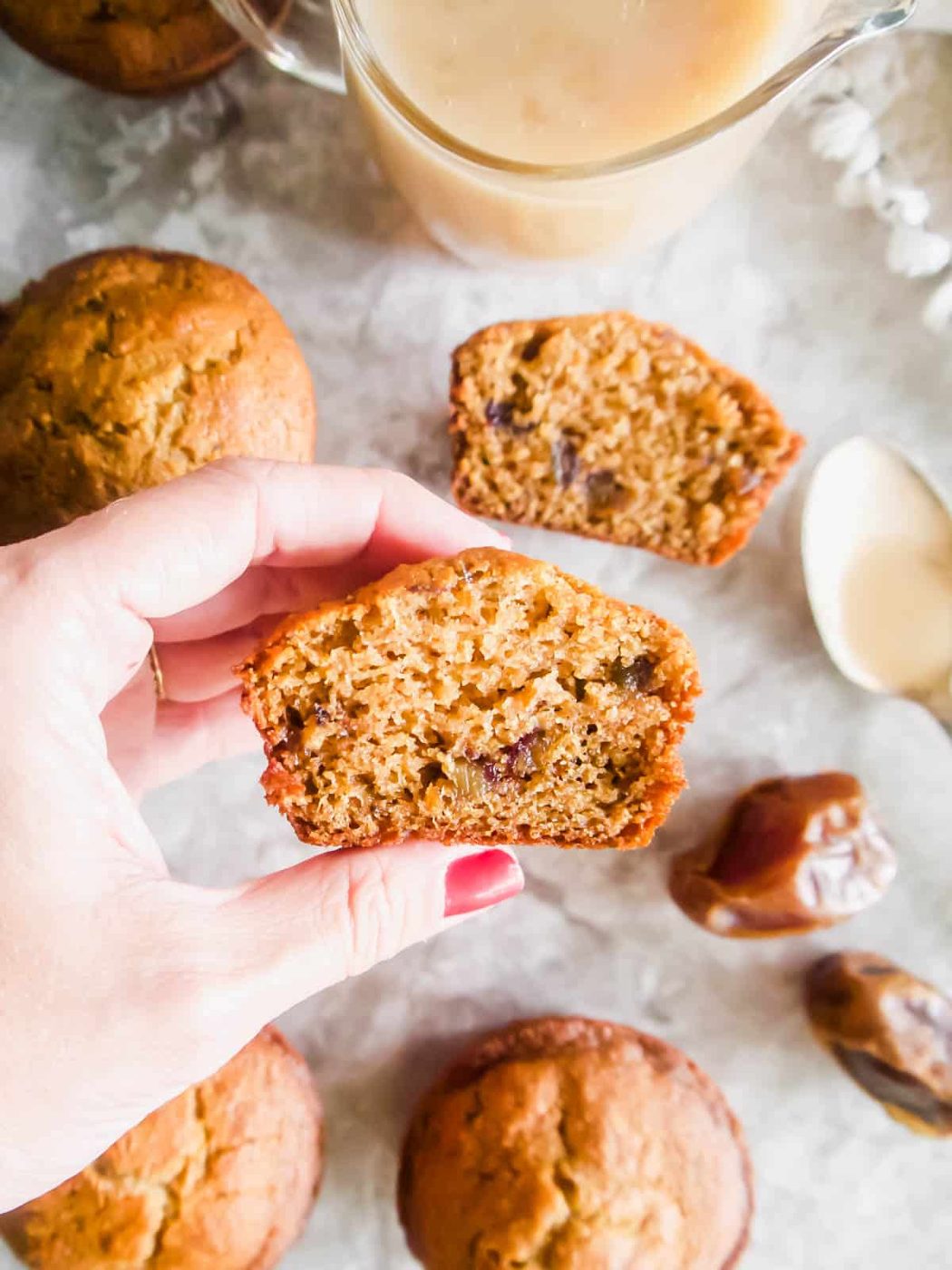 A lighter sticky toffee pudding muffin cut in half.