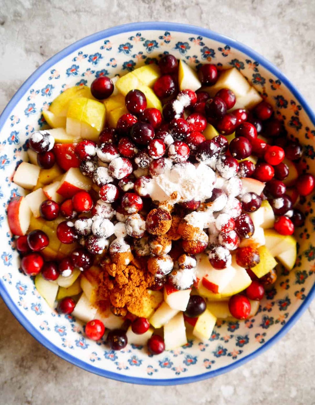 Cut up pear and cranberries in baking dish.