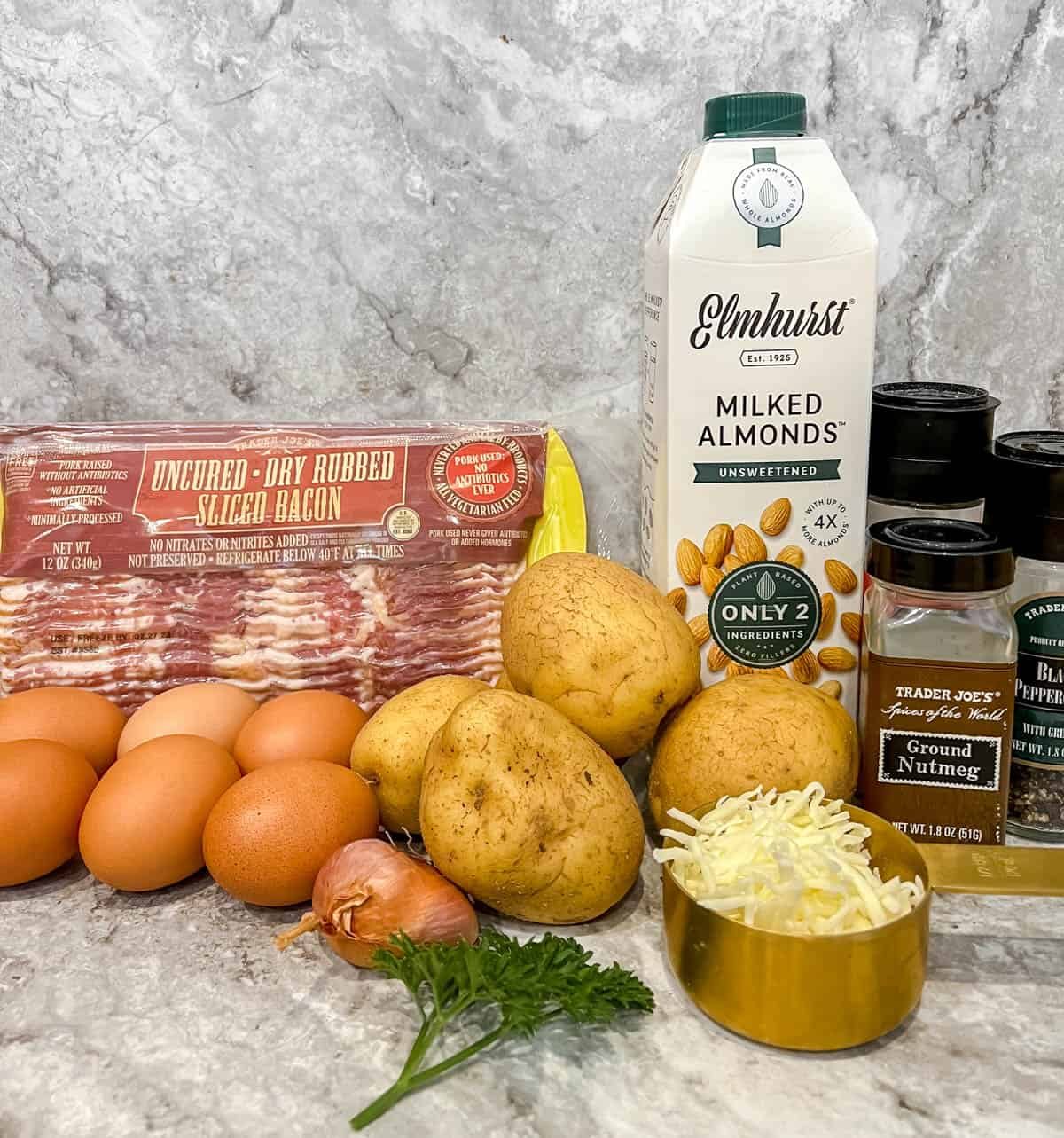 Ingredients needed to make potato crust quiche lorraine.