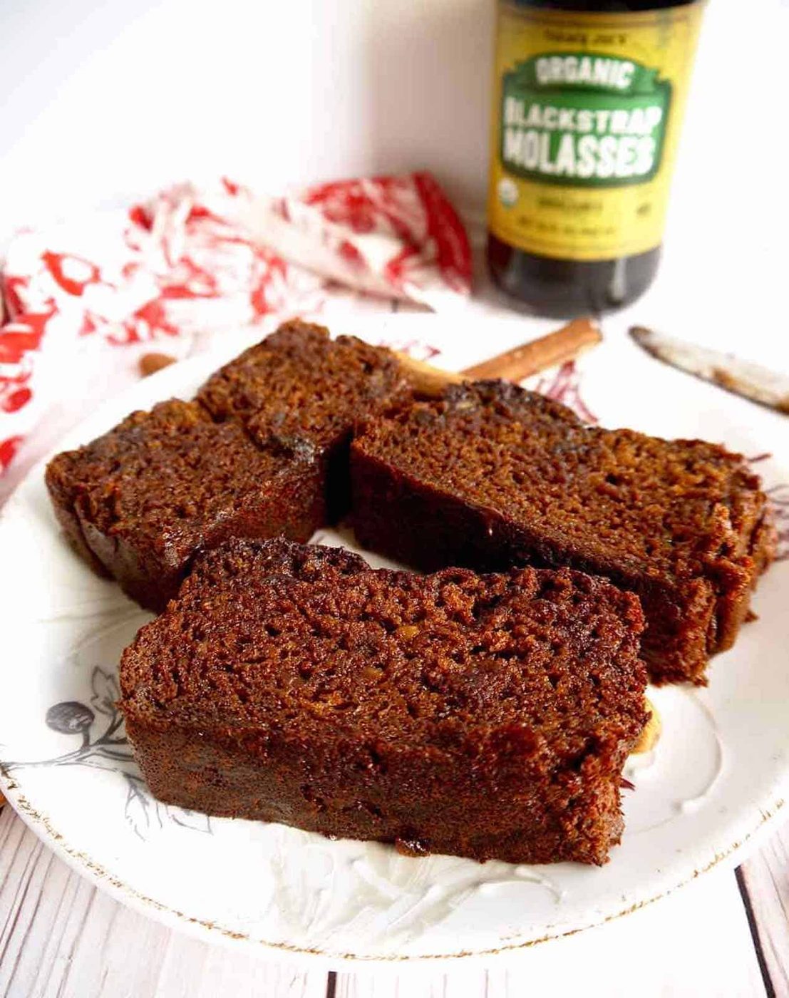 Slice of paleo gingerbread loaf on a plate.
