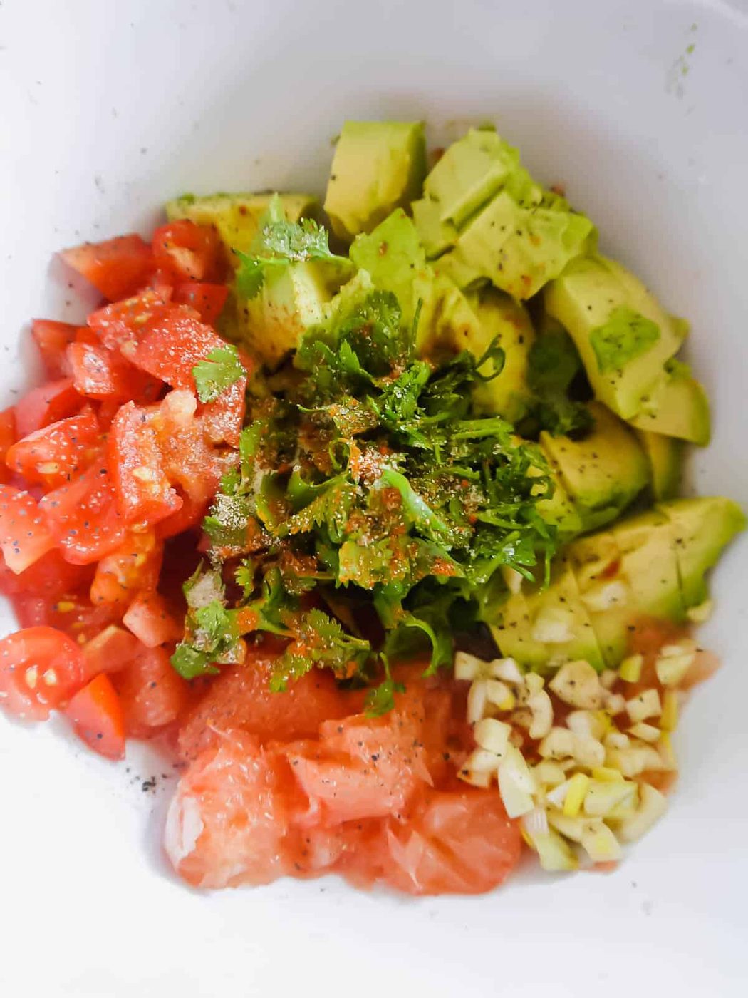 All the ingredients needed for grapefruit guacamole.