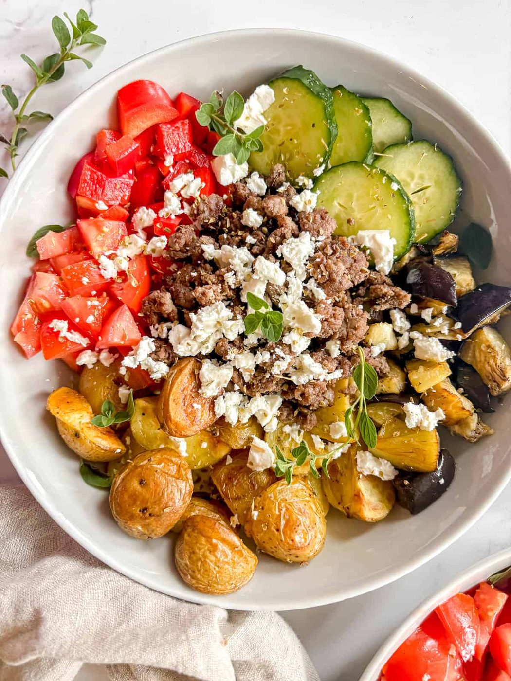 Lighter ground beef bowl filled with Mediterranean flavor