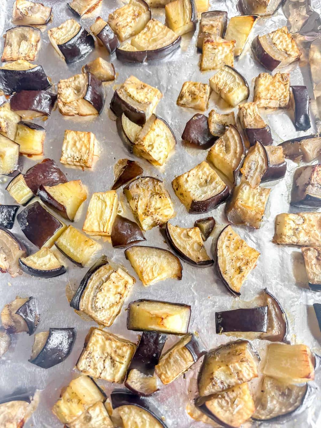 Roasted eggplant on a cookie sheet.