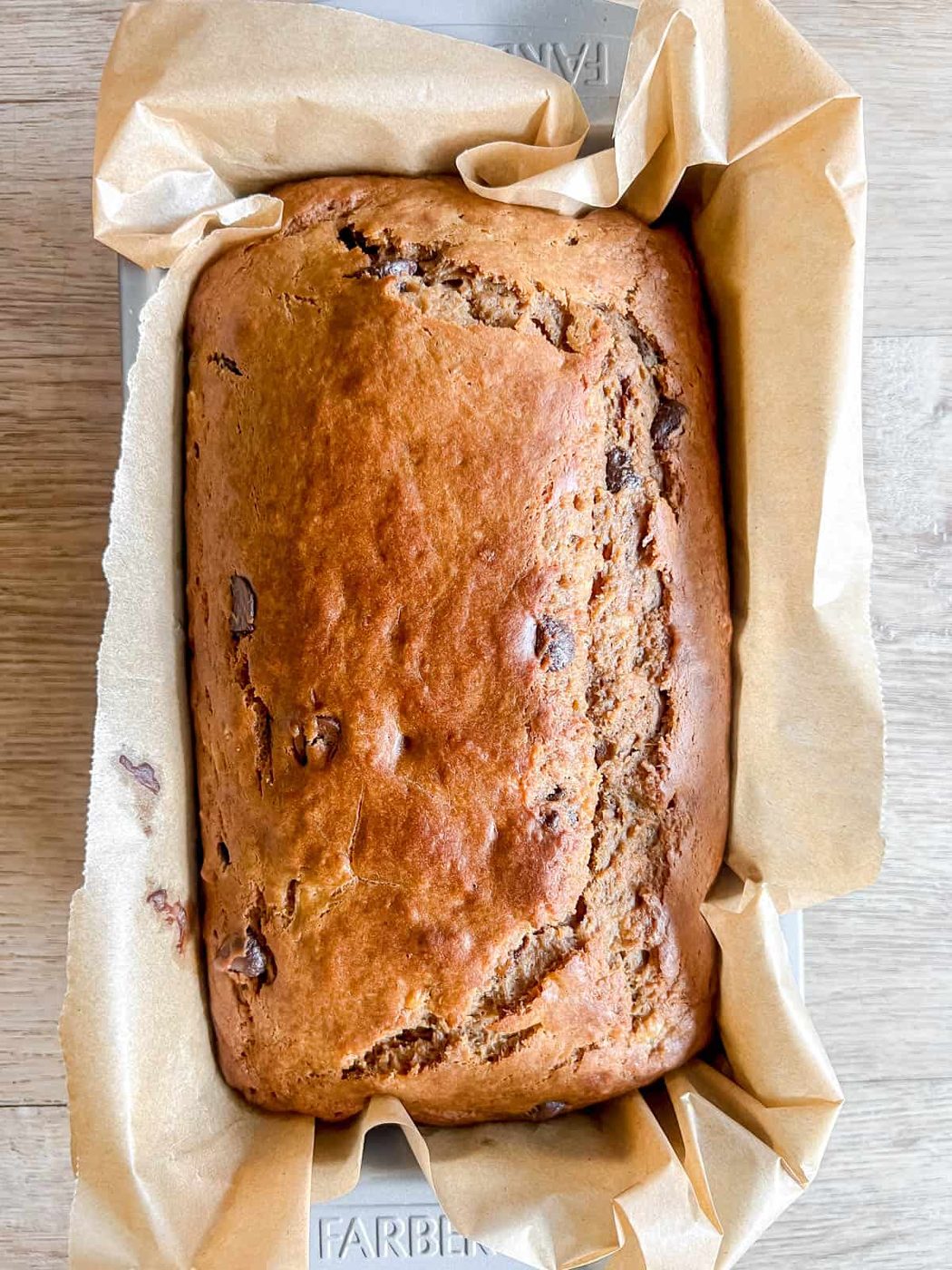 Greek yogurt banana bread in a pan after baking.
