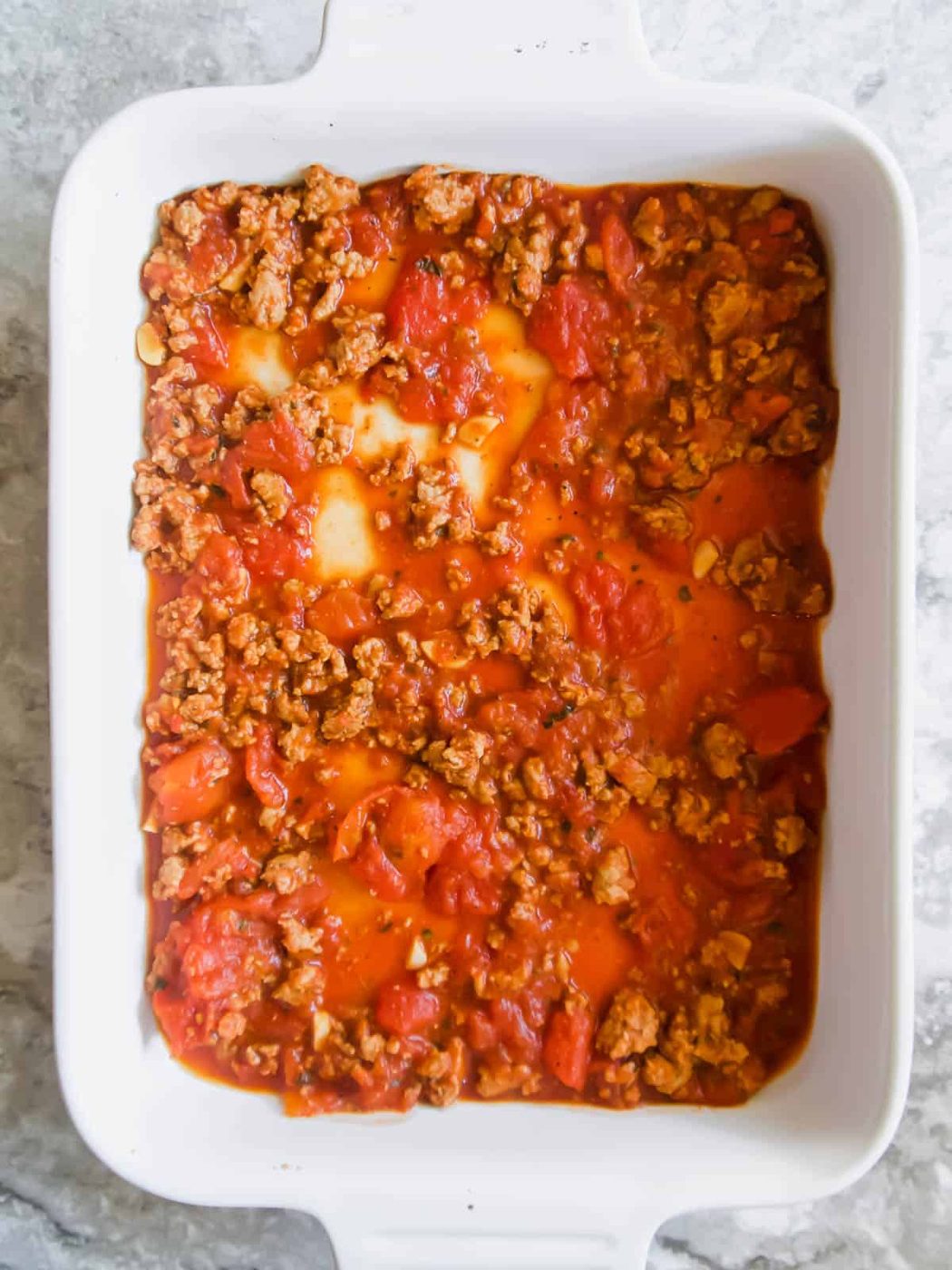 Meat sauce layer in the pan.