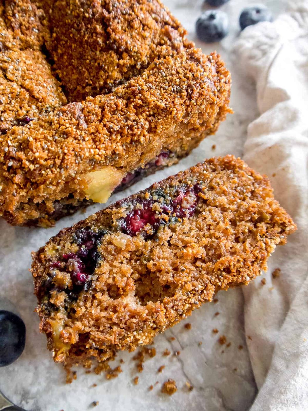 A slice of almond flour apple bread on a table.