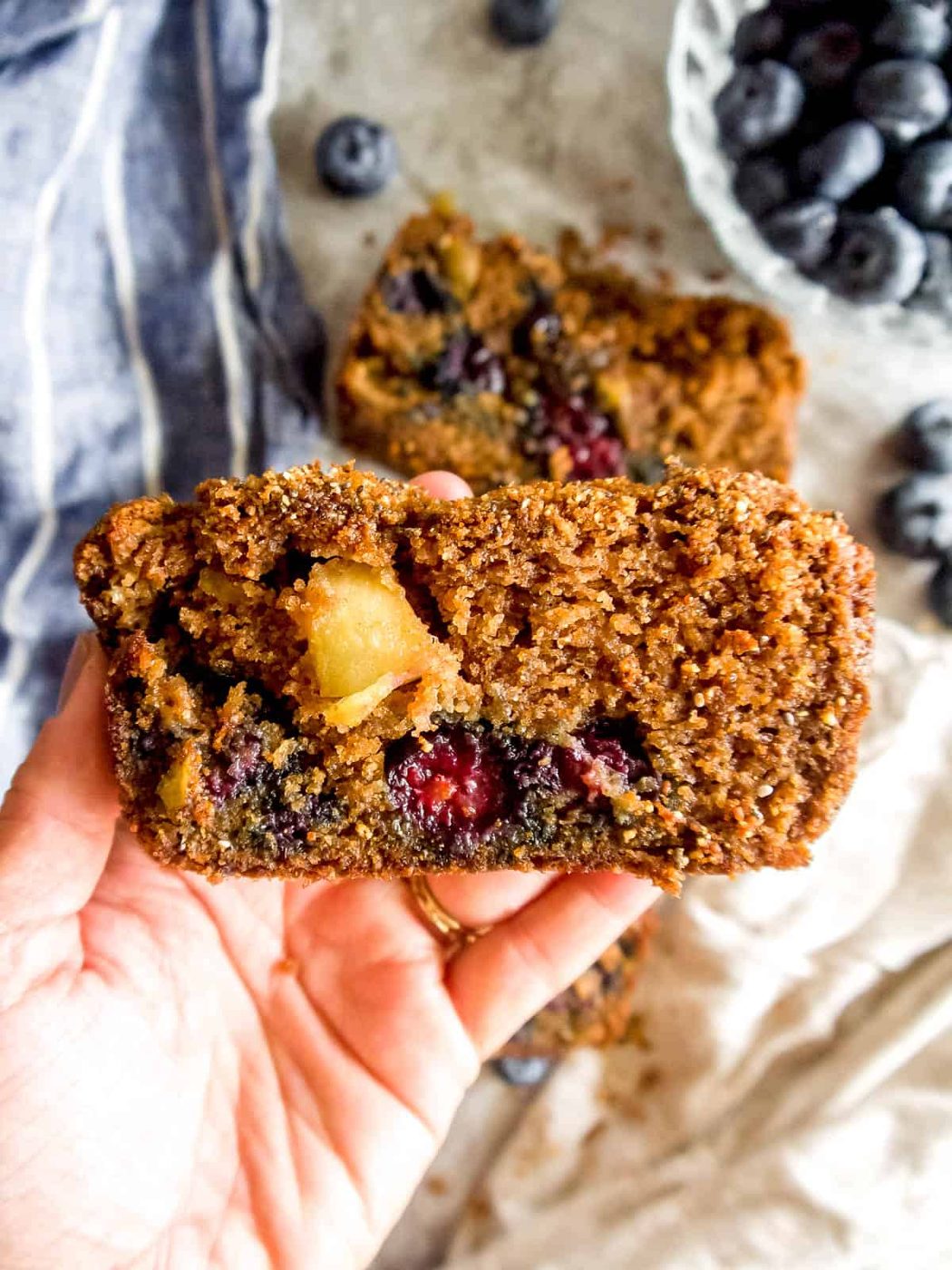 Blueberry bread made with almond flour in one's hands.