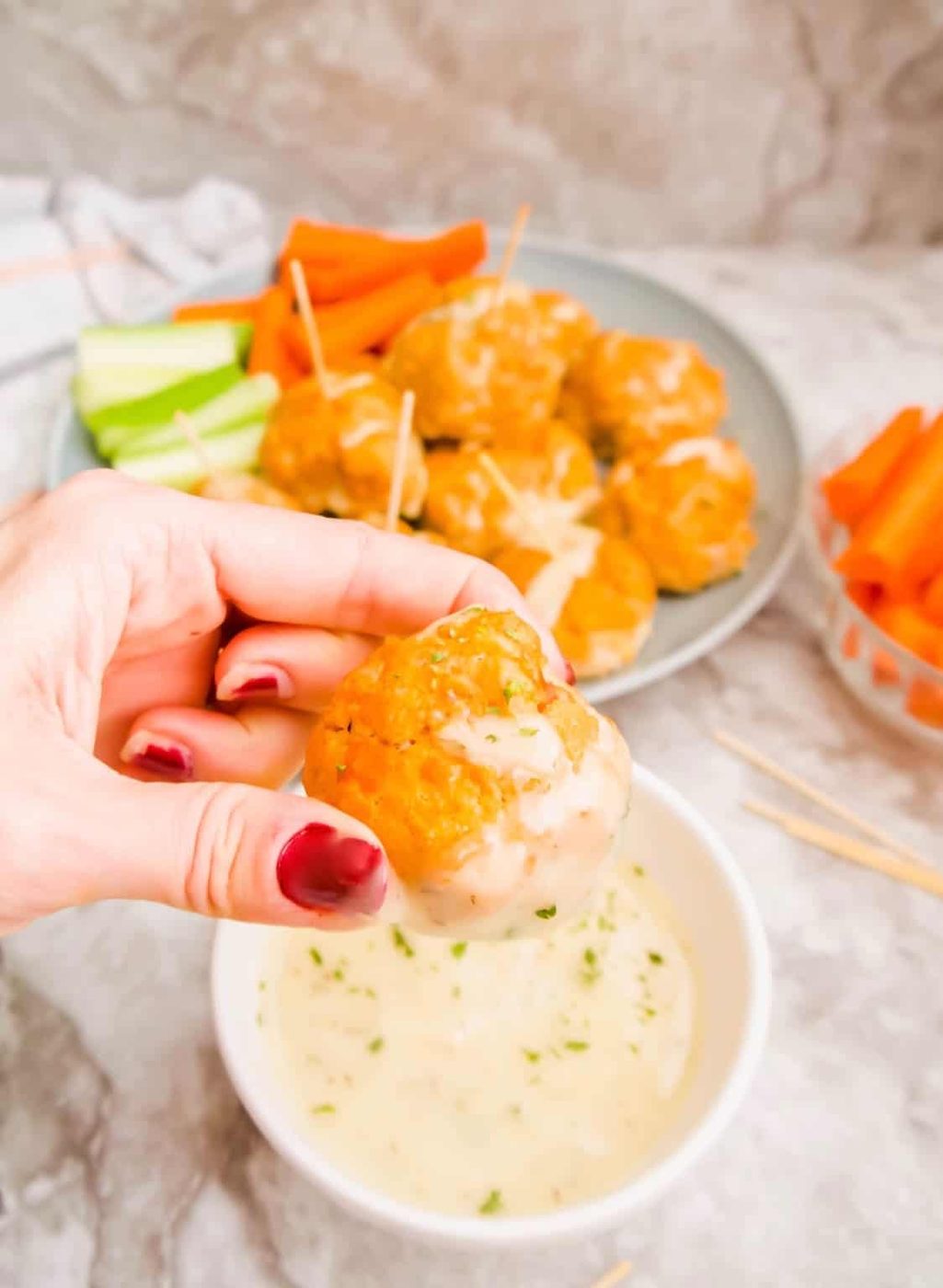 Dipping a buffalo turkey meatball into ranch.