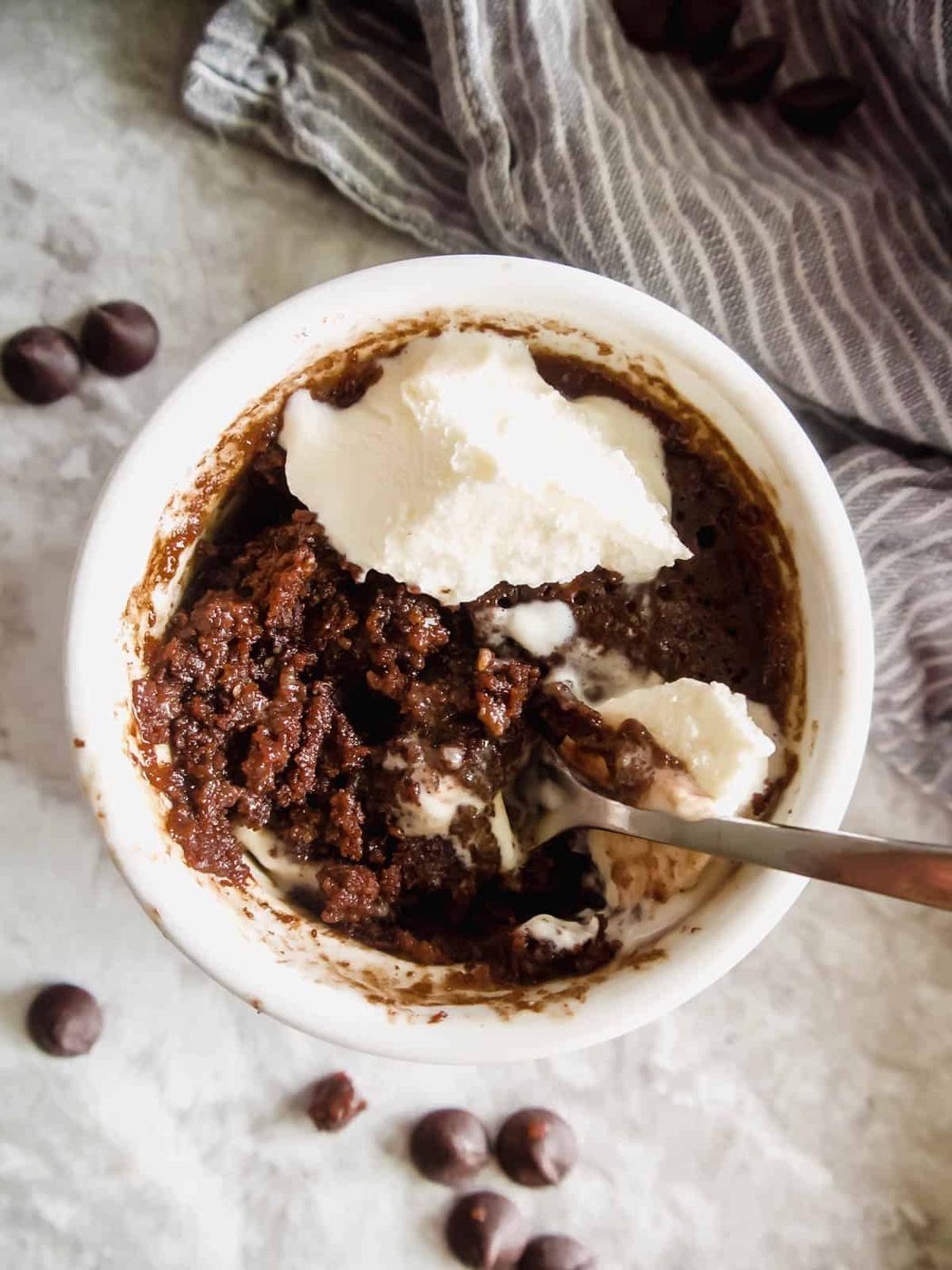 Gluten free mug brownie with ice-cream on top.
