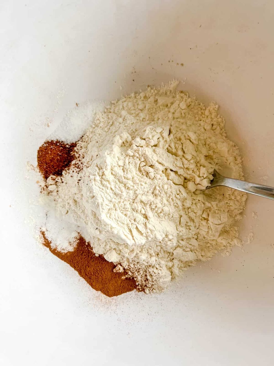 Pumpkin banana bread dry ingredients in a bowl.