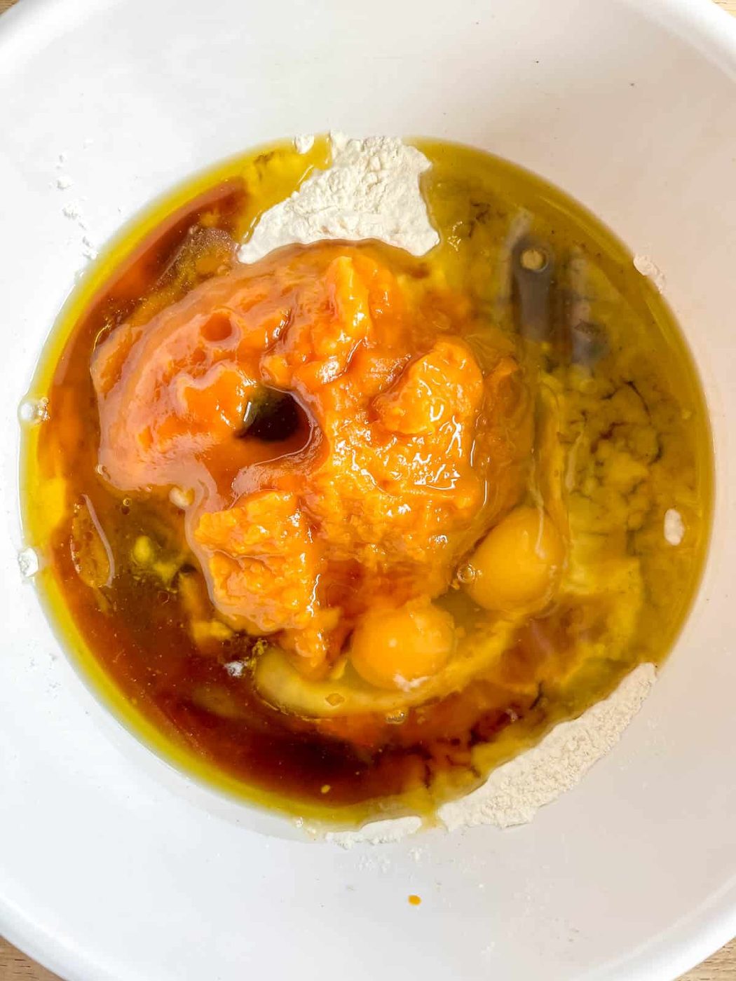 Pumpkin banana bread wet ingredients in a bowl.