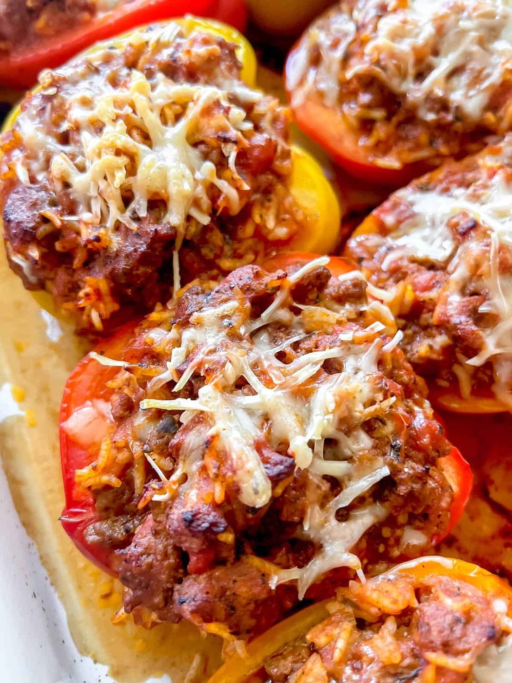 Lighter stuffed peppers with melted cheese on top freshly cooked.