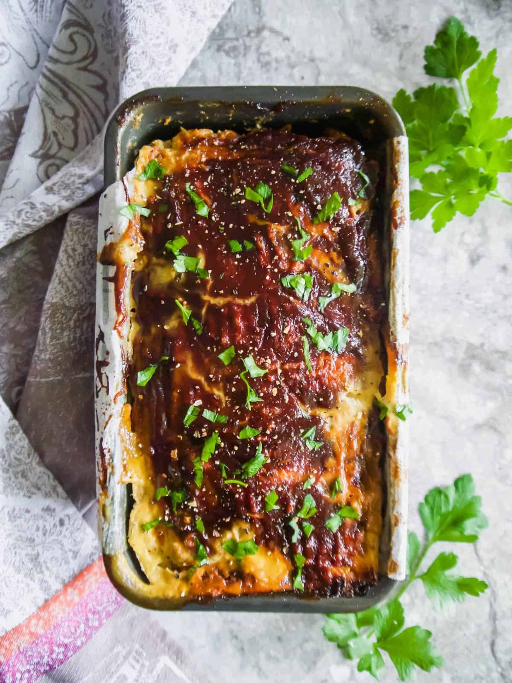 Meatloaf with ground turkey in a loaf tin after baking.