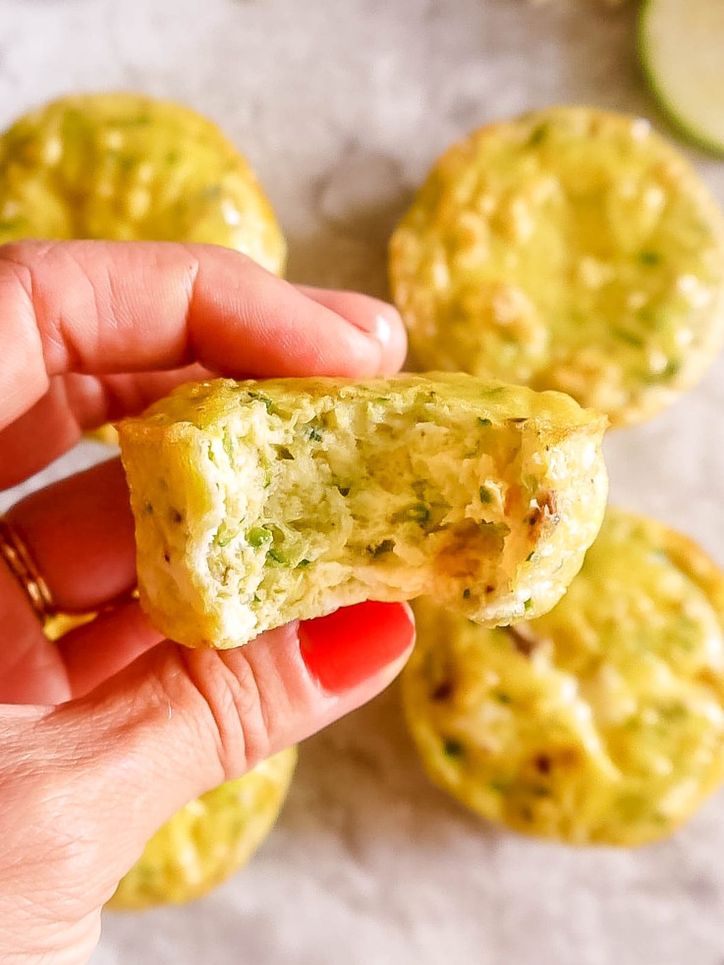 A bite taken out of zucchini egg muffins.