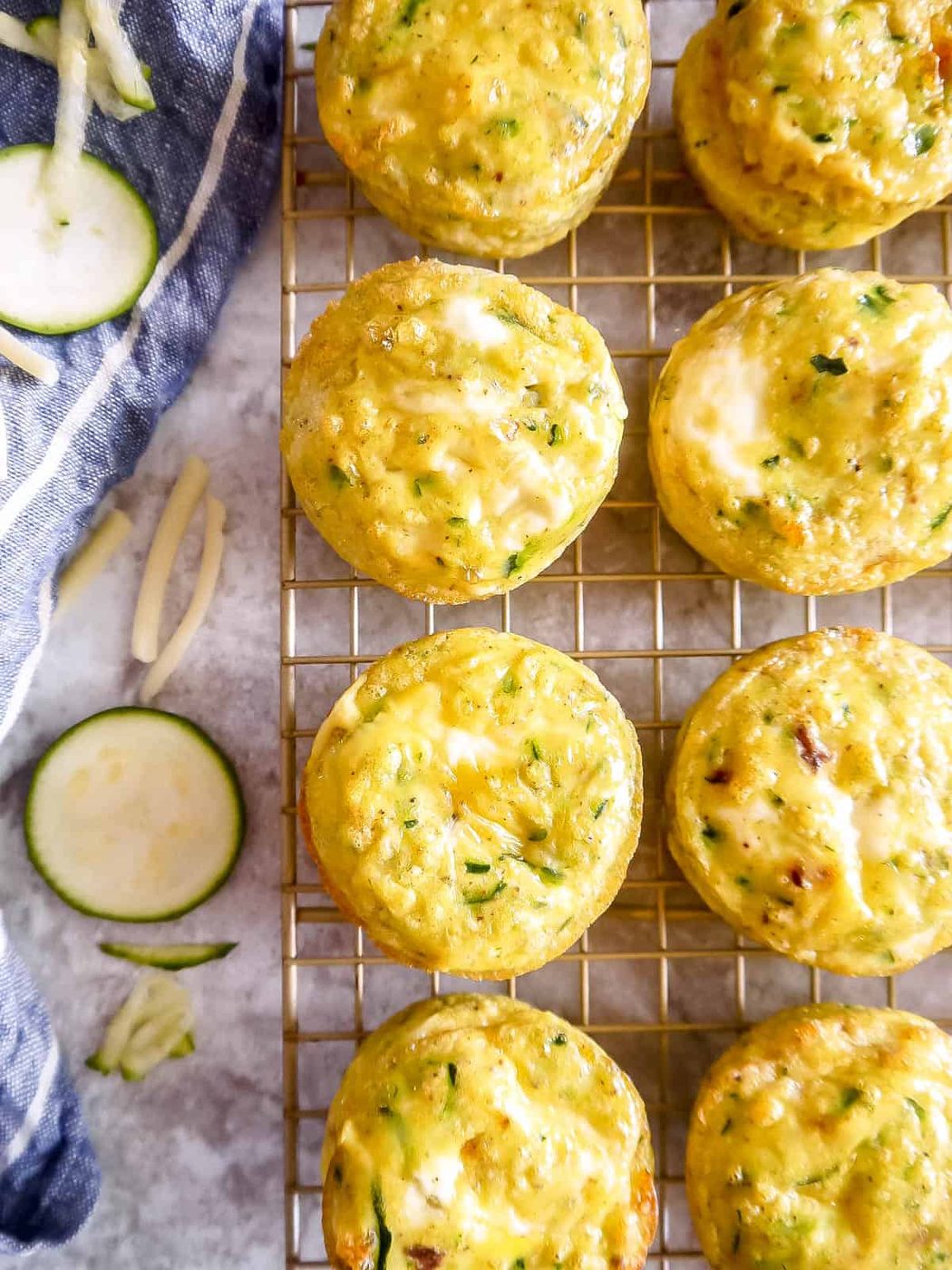 Zucchini egg cups on wire rack.