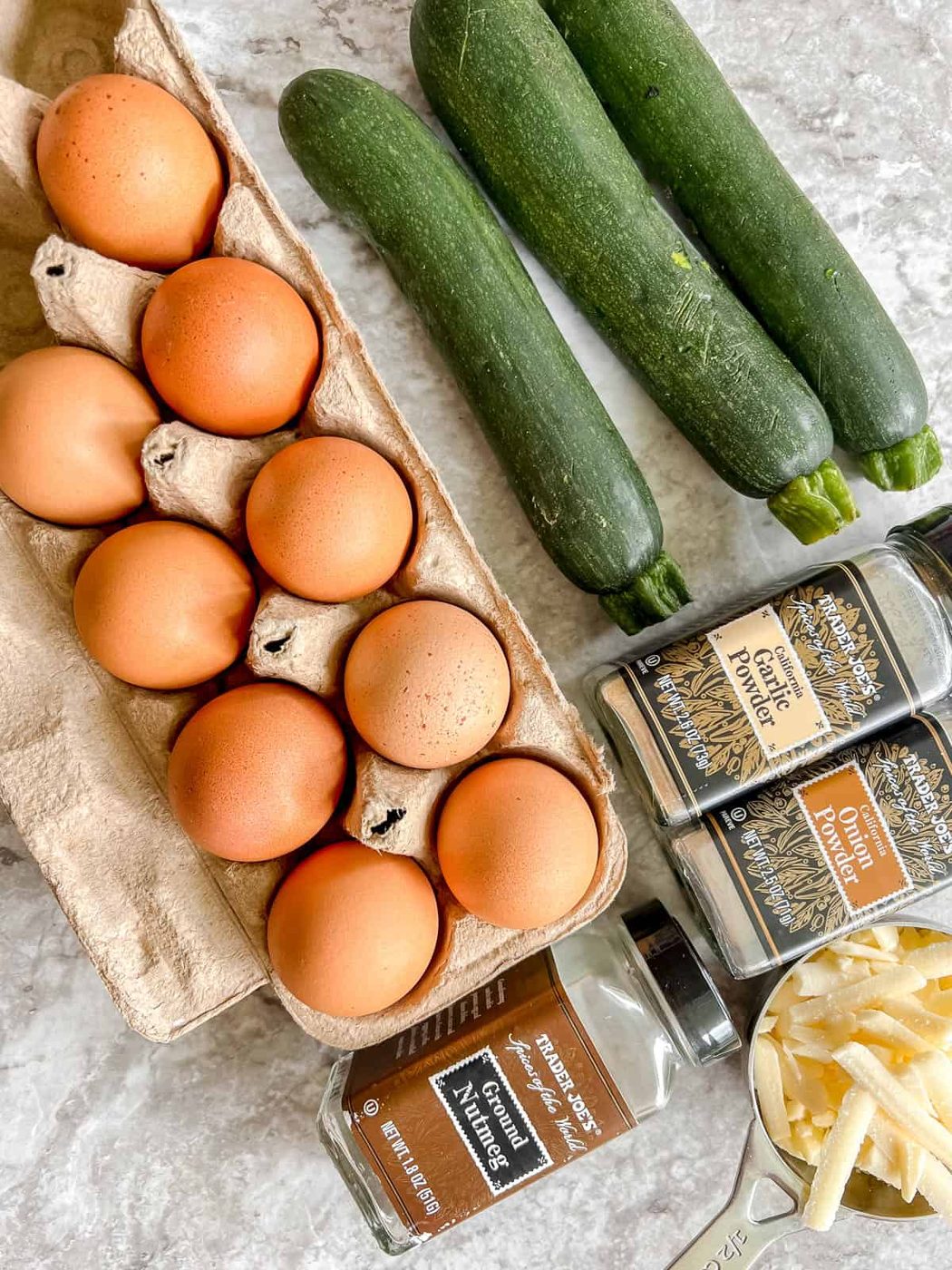 Ingredients needed to make Zucchini Egg Muffin Cups.