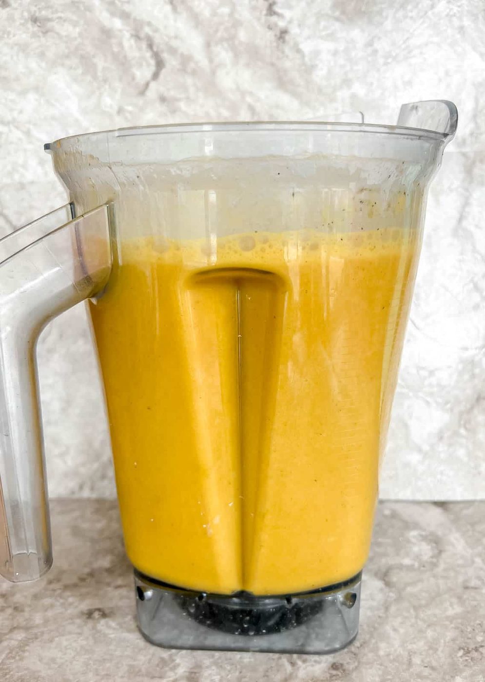 Lighter butternut squash soup in a blender after mixed.