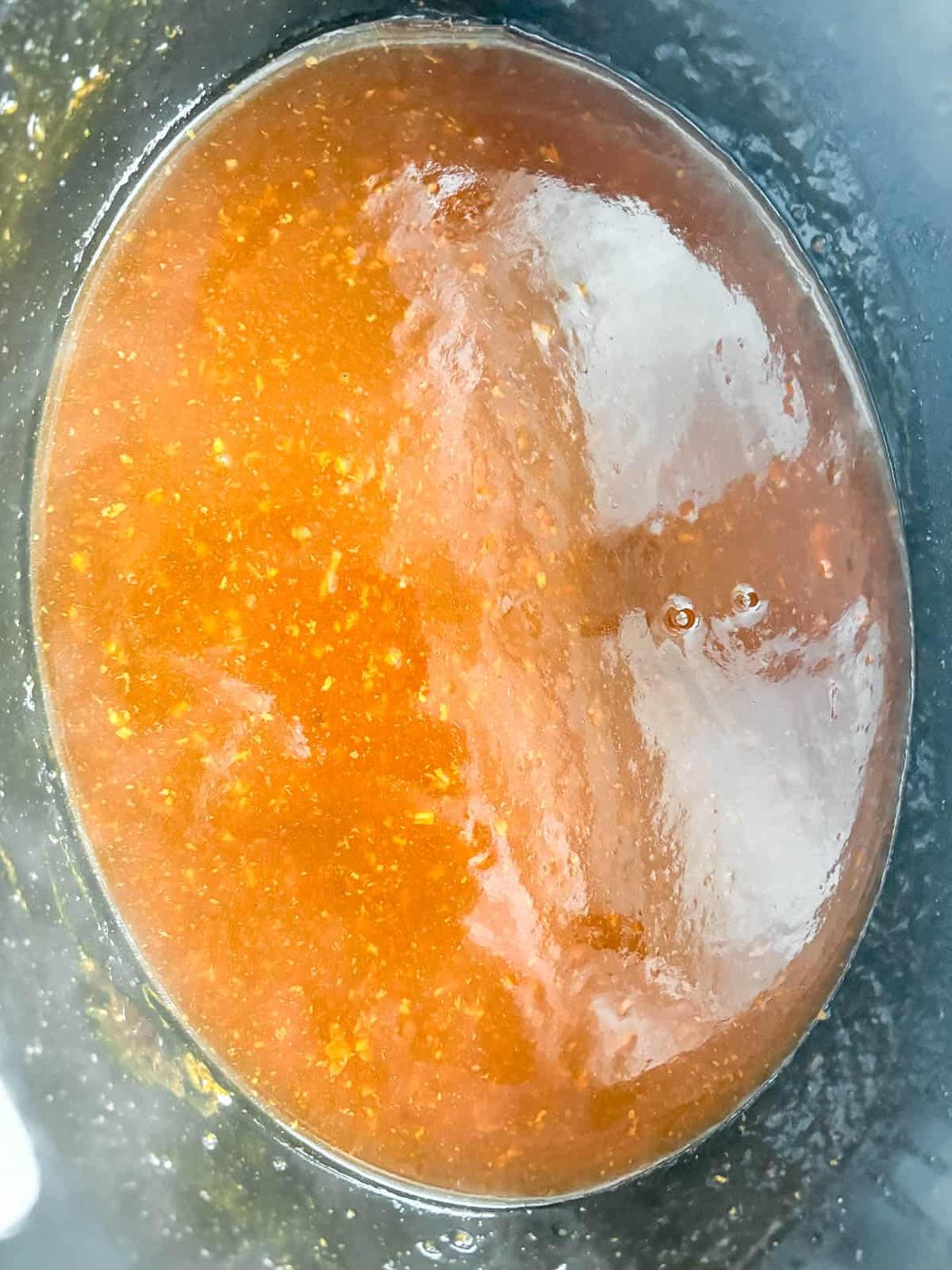 Thickening the honey garlic sauce.