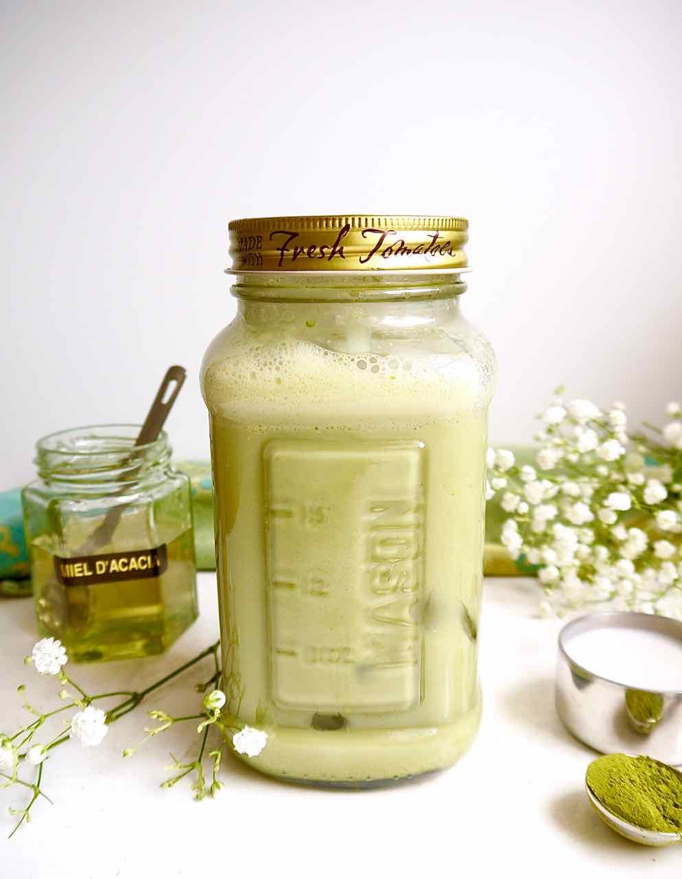 Iced Almond Milk Matcha latte in mason jar.